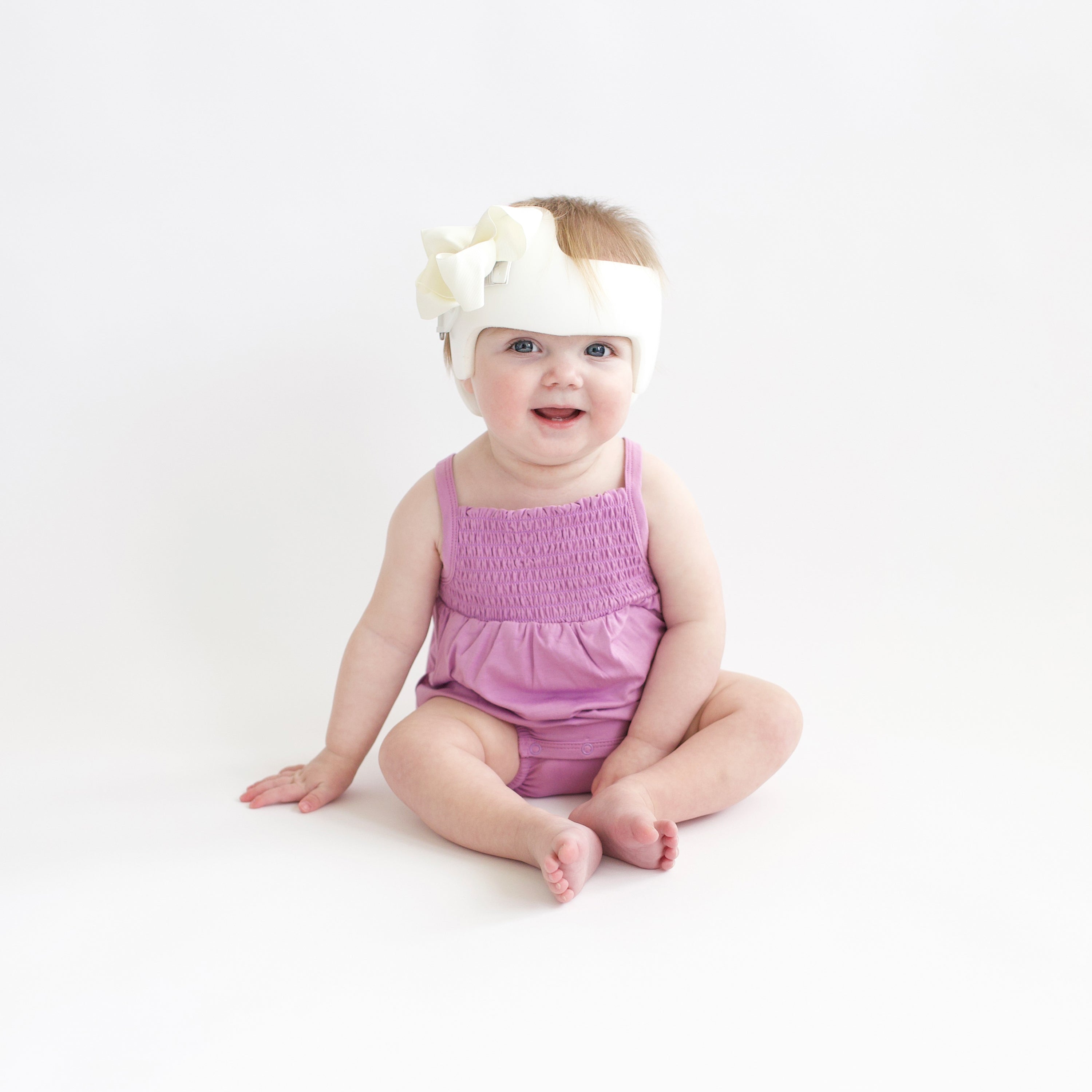 Toddler wearing Smocked Bubble Romper in Poi