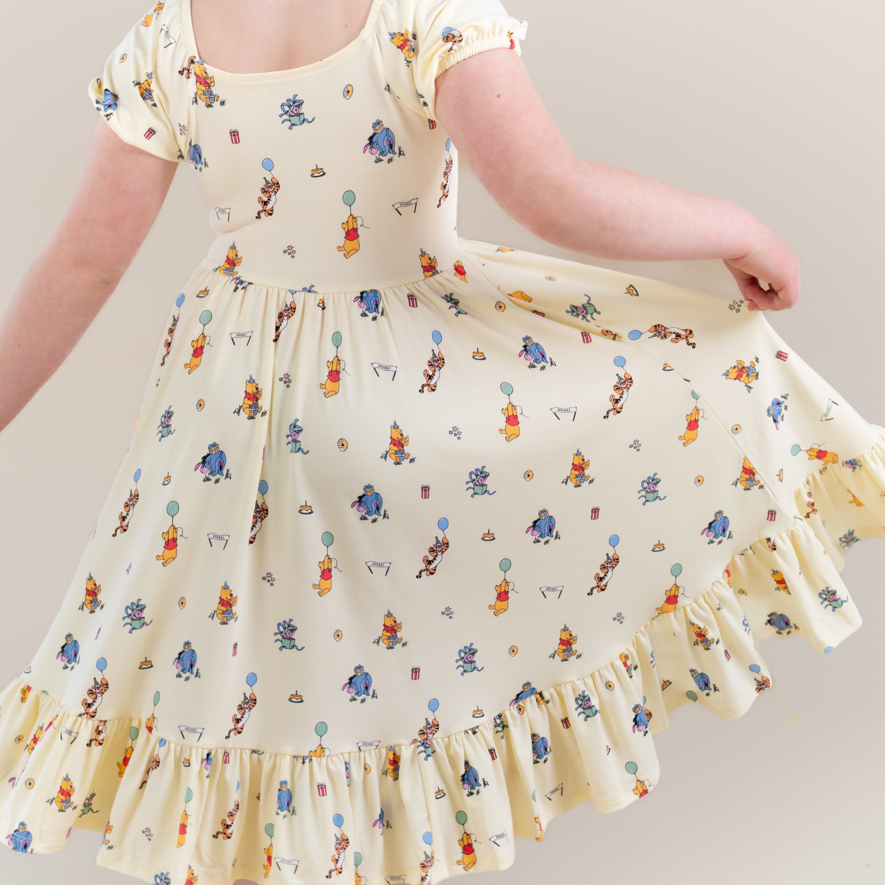 The back of the Puff Sleeve Twirl Dress in Winnie the Pooh Celebration