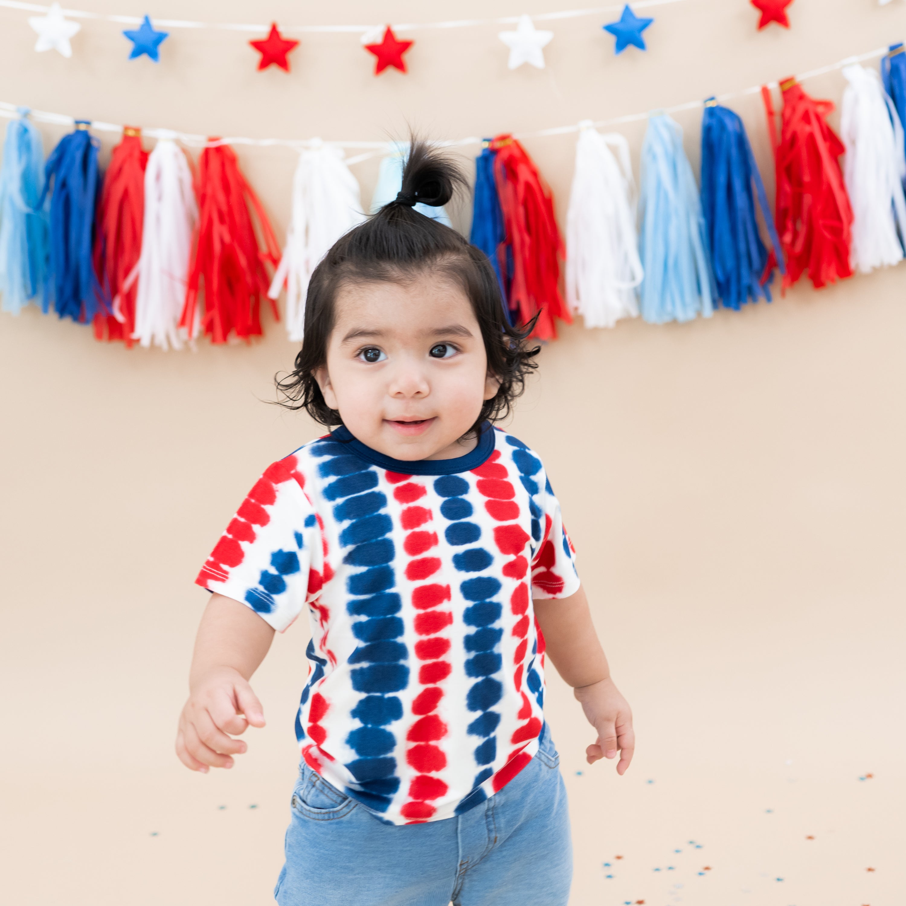 Toddler modeling Toddler Basic Tee in Liberty Rip Tide with 4th of July backdrop