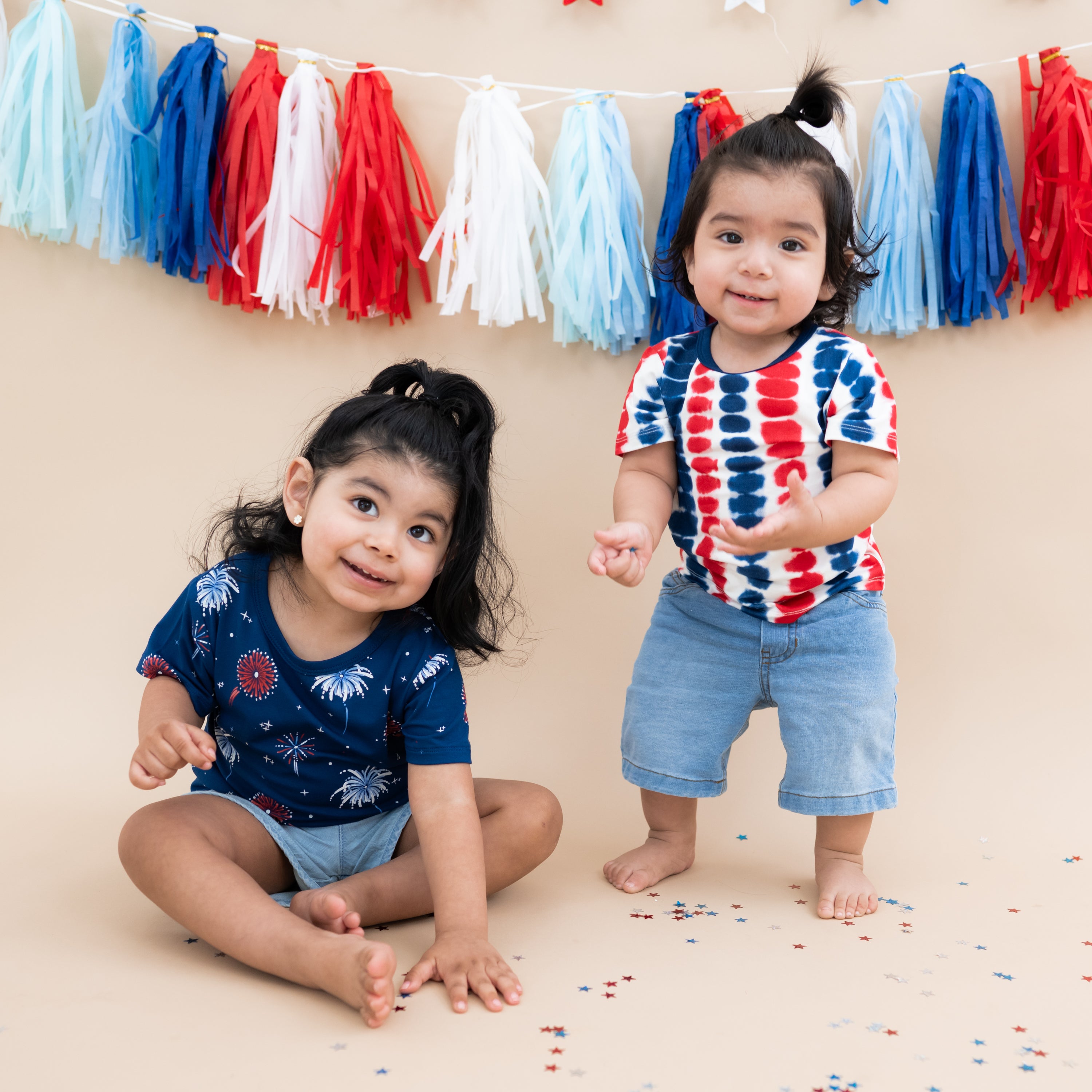Two toddlers modeling Basic Tees in Celebration and Liberty Rip Tide