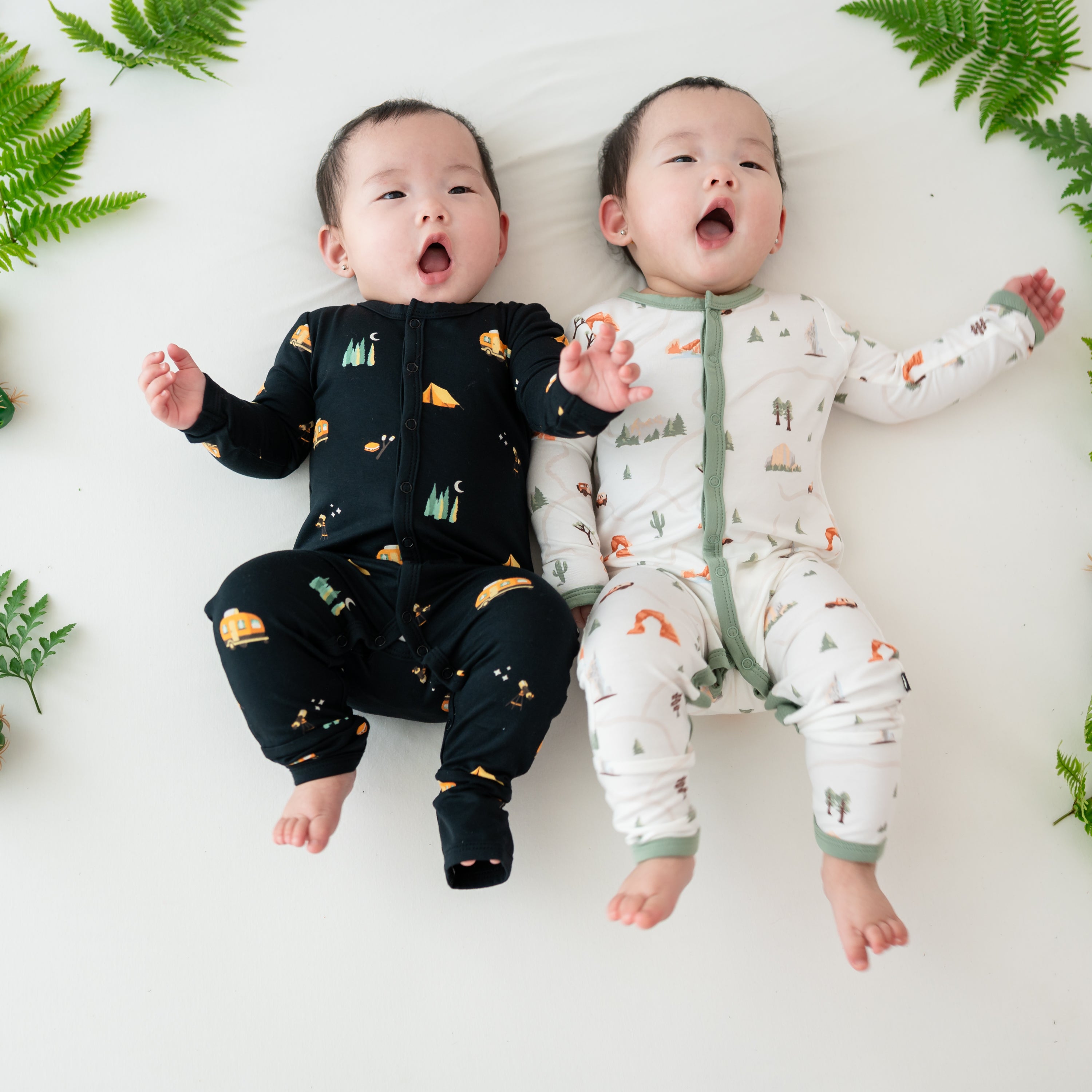 Babies wearing Snap Rompers in Under the Stars and Road Trip camping prints