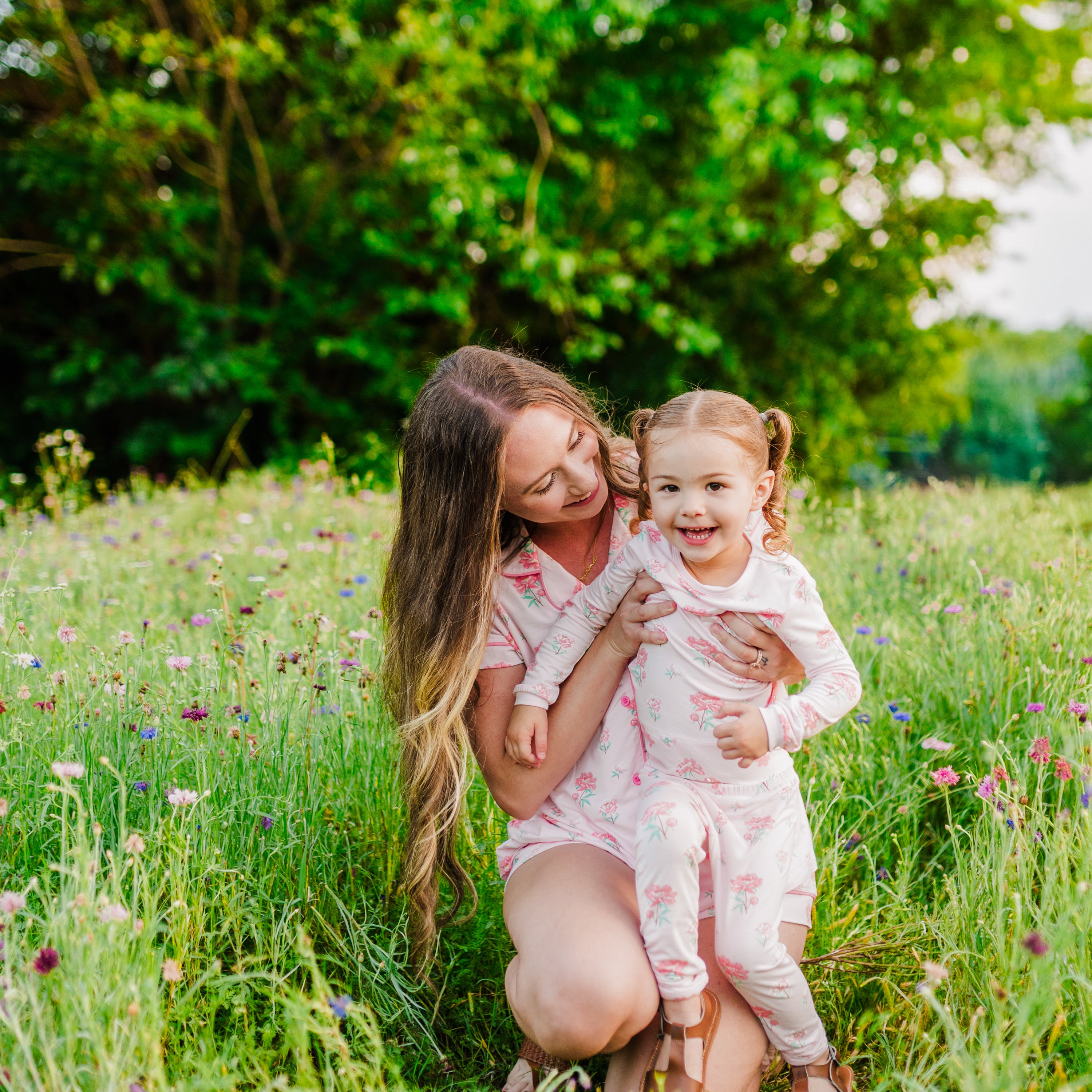 Mom and toddler wearing matching Sakura Peony pajamas