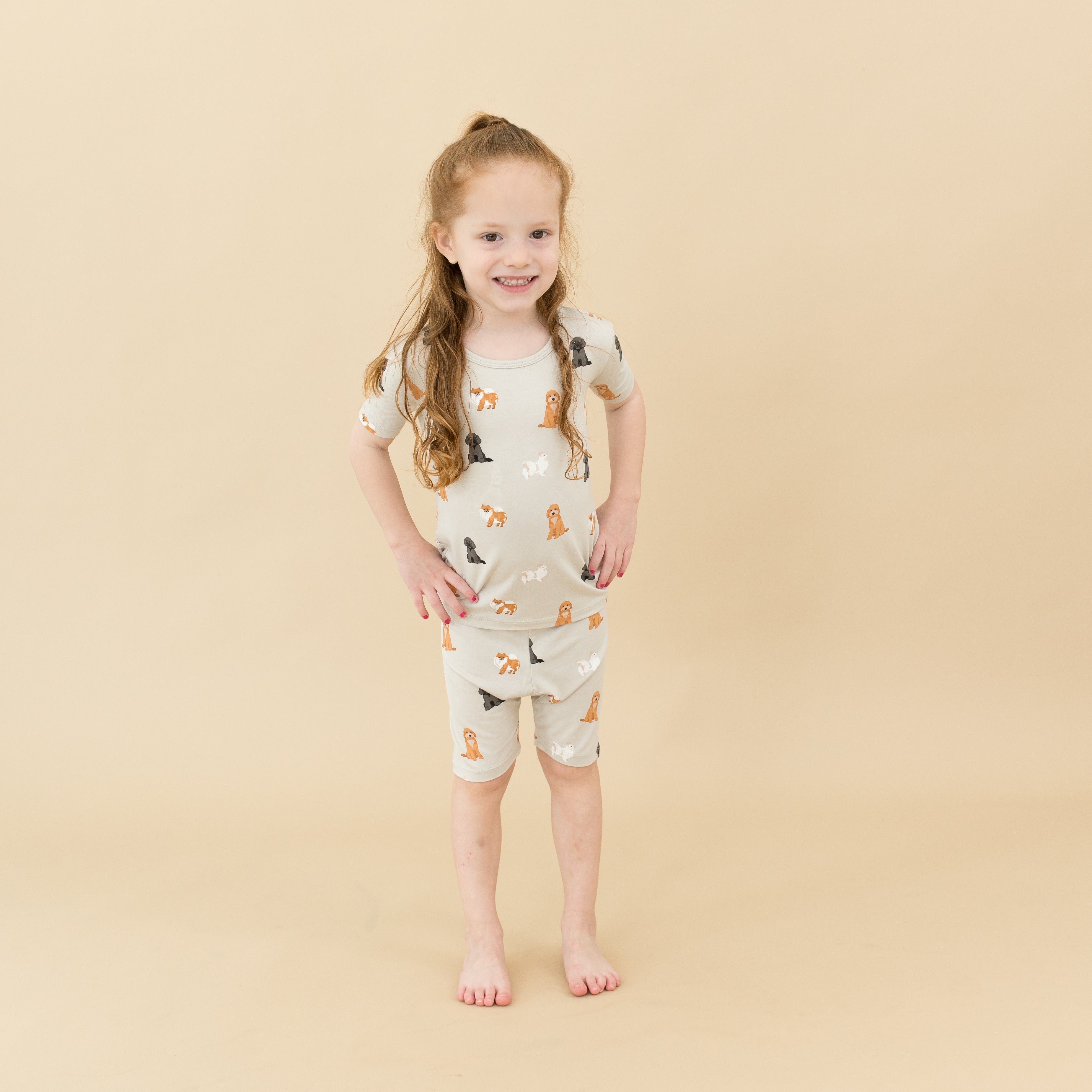 Child modeling Short Sleeve Pajamas in Fluffy Dog
