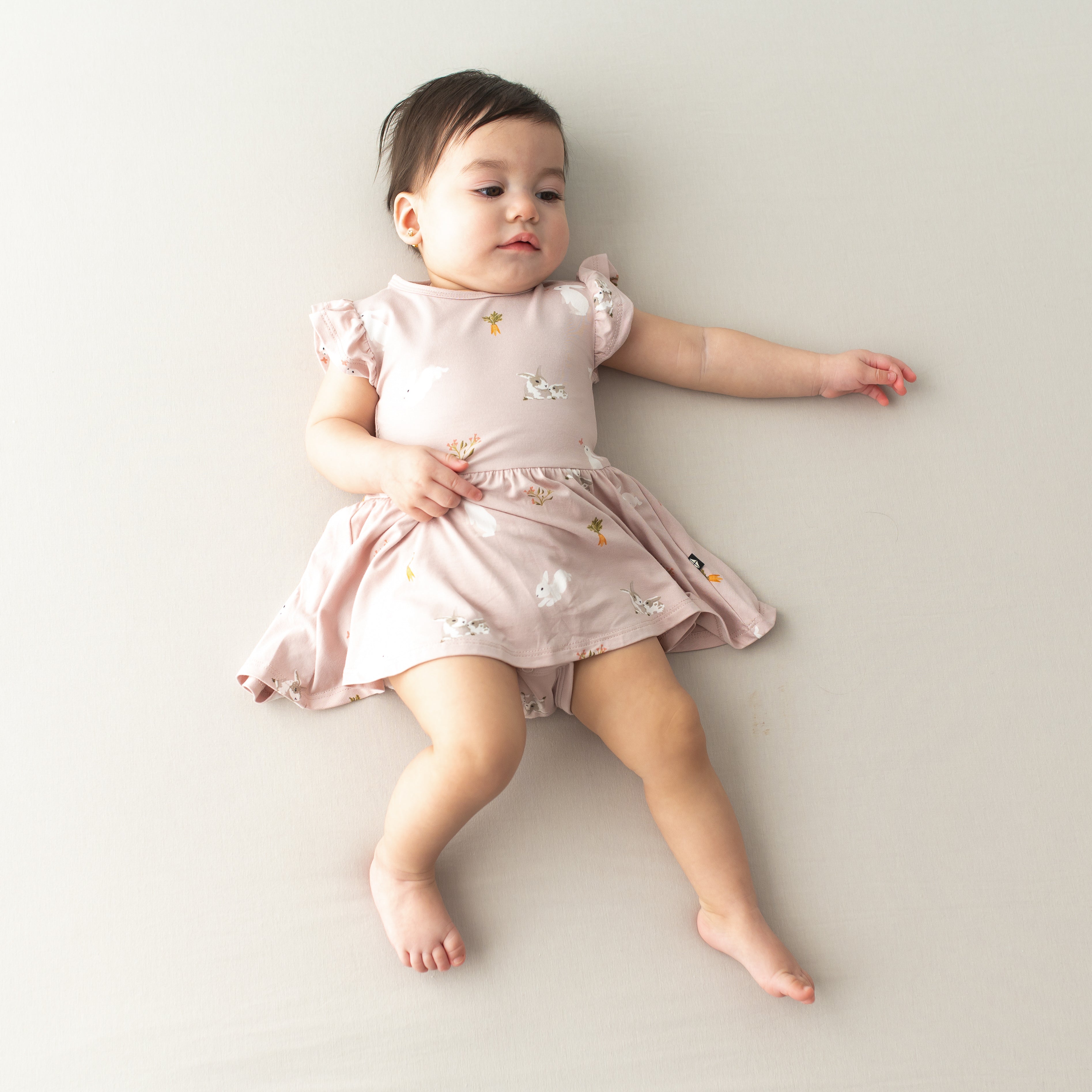 Baby wearing Pink Twirl Bodysuit Dress Easter Outfit in Blush Rabbit