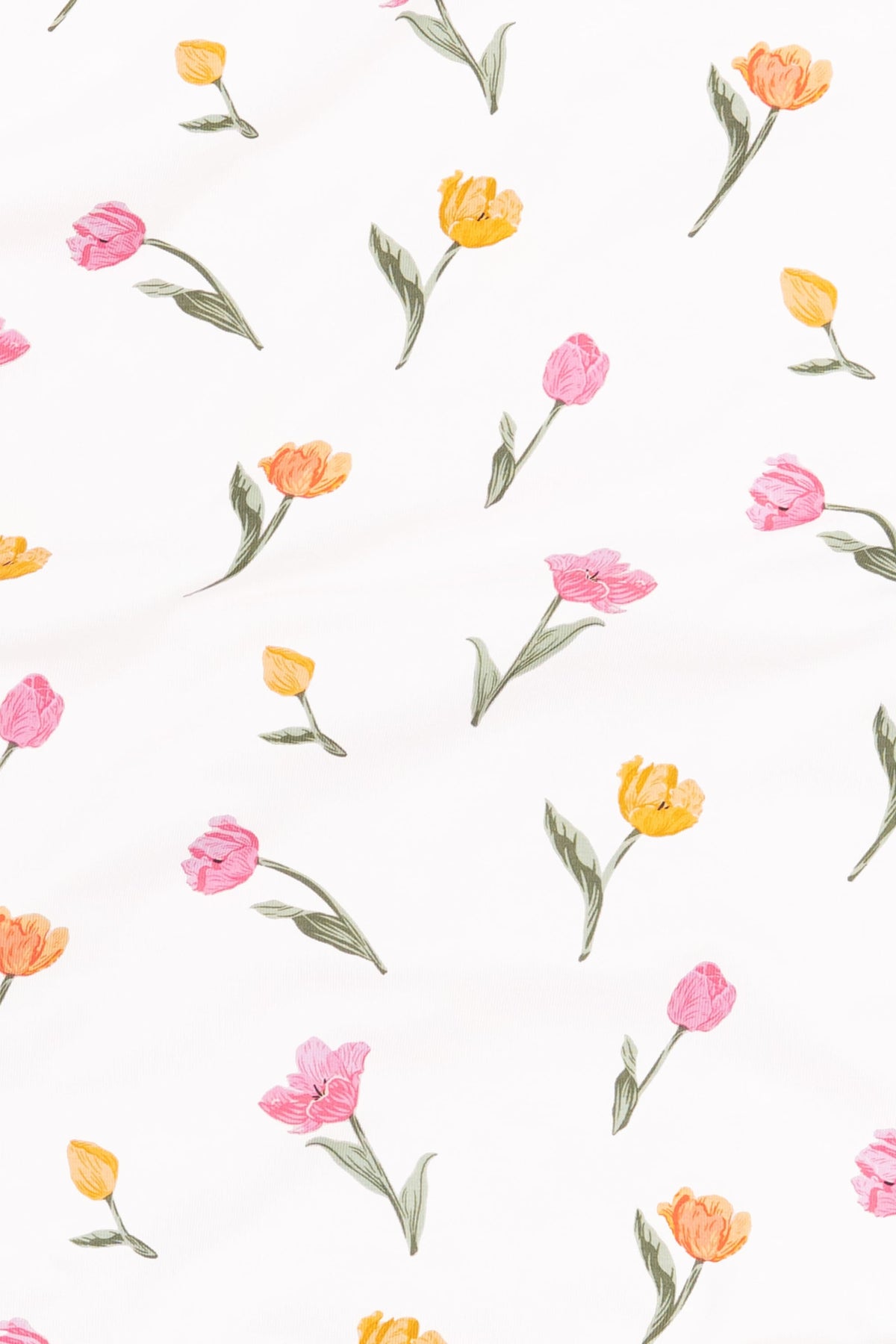 Close up of the fabric swatch of the print tulip showing the yellow, orange and pink tulips with green stems on a white background