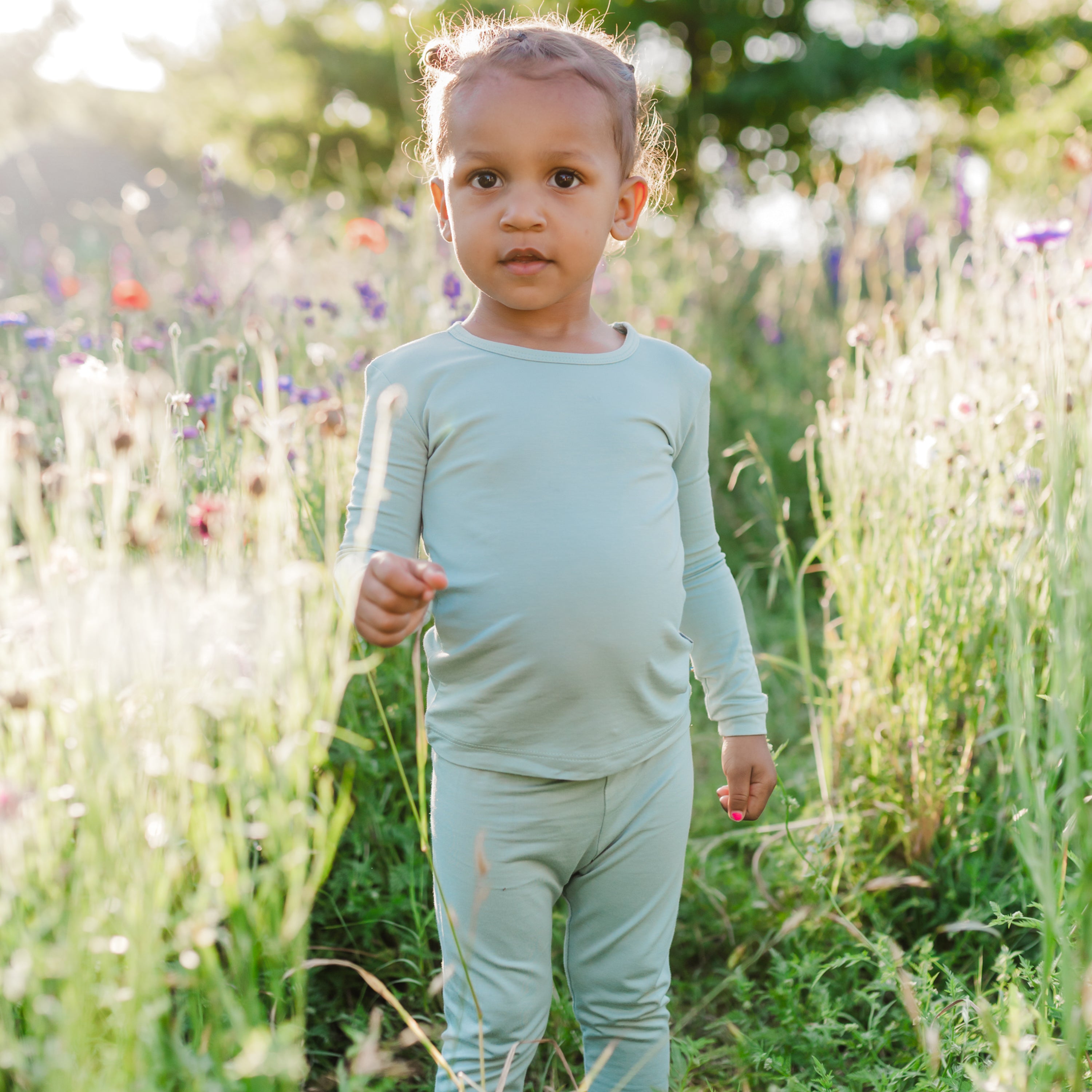 Toddler wearing Long Sleeve Pajamas in Sage green