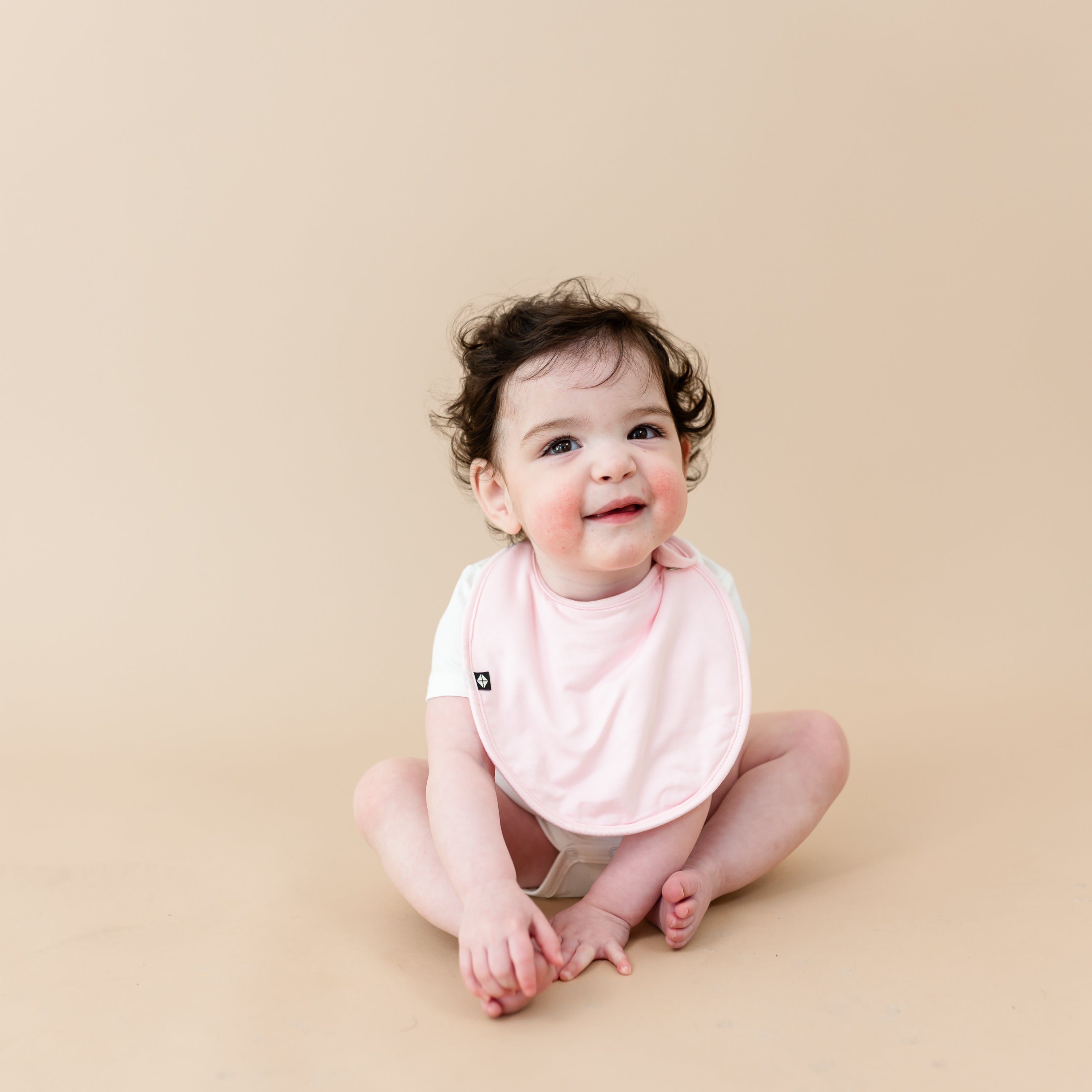 Baby wearing Bamboo Cushy Bib in Sakura