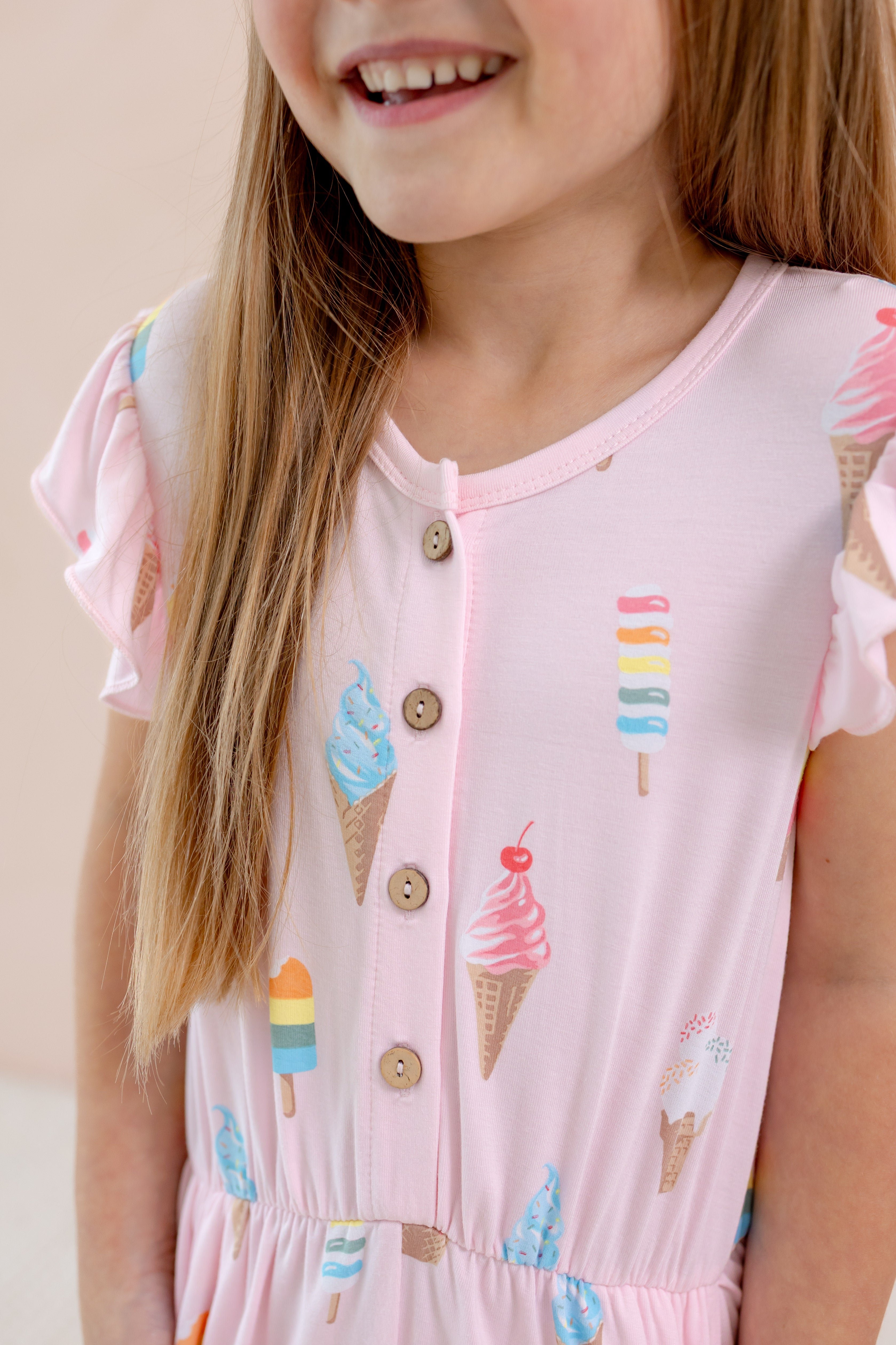 Flutter Sleeve Romper front part with buttons in Sakura Ice ream print