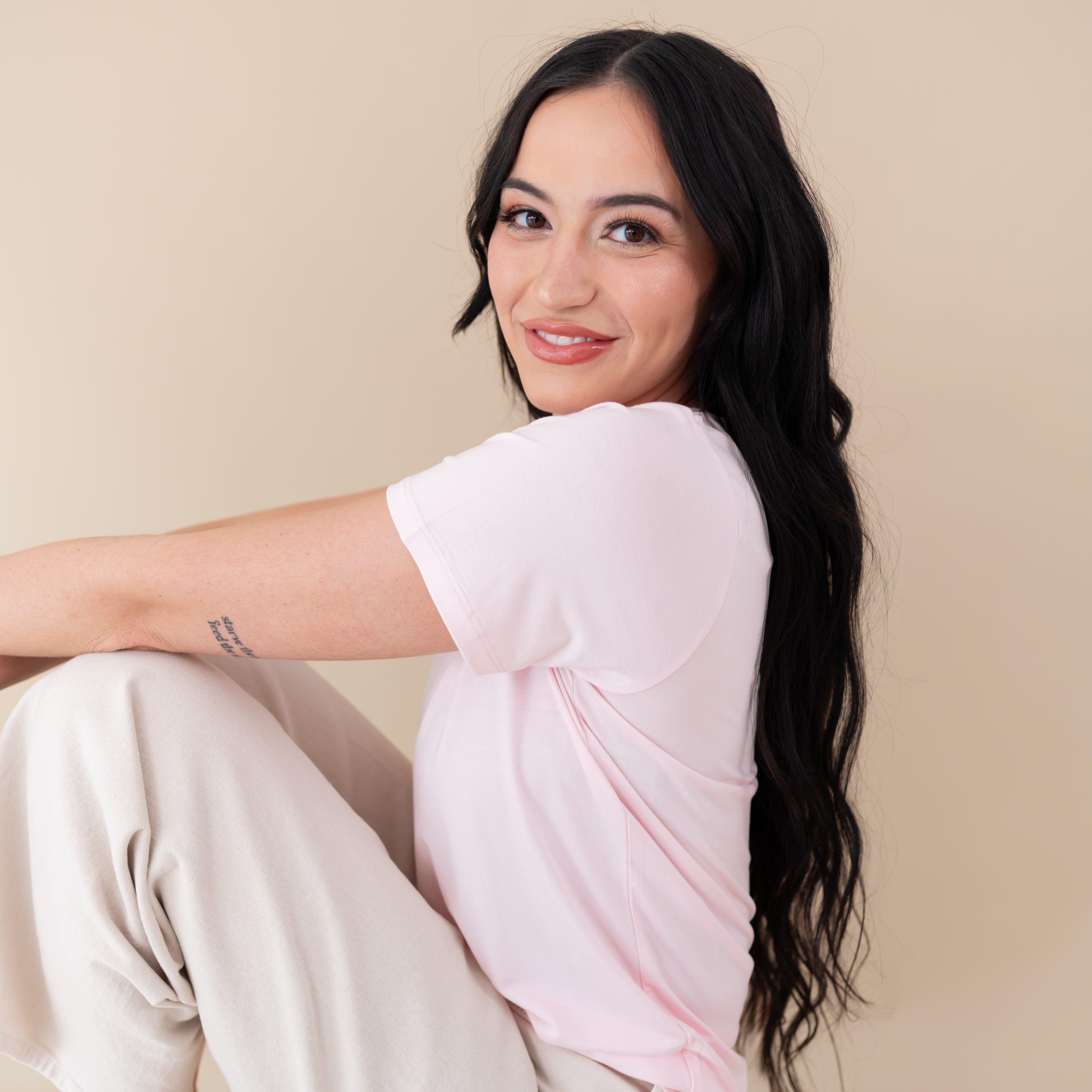 Woman modeling Women's Crew Neck Tee in Sakura close up