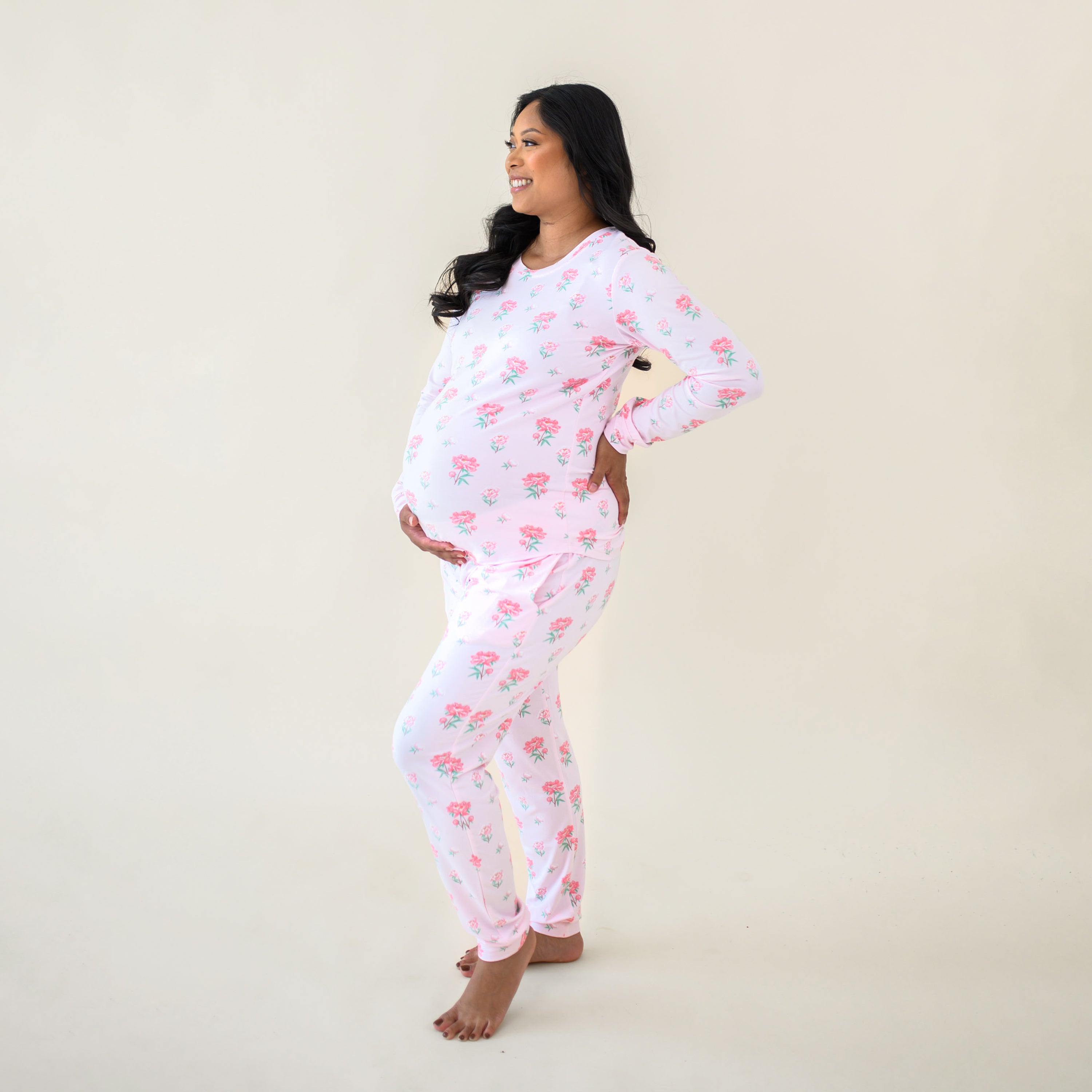 Side view of an expectant mother wearing the Women's Jogger Pajama Set in Sakura Peony