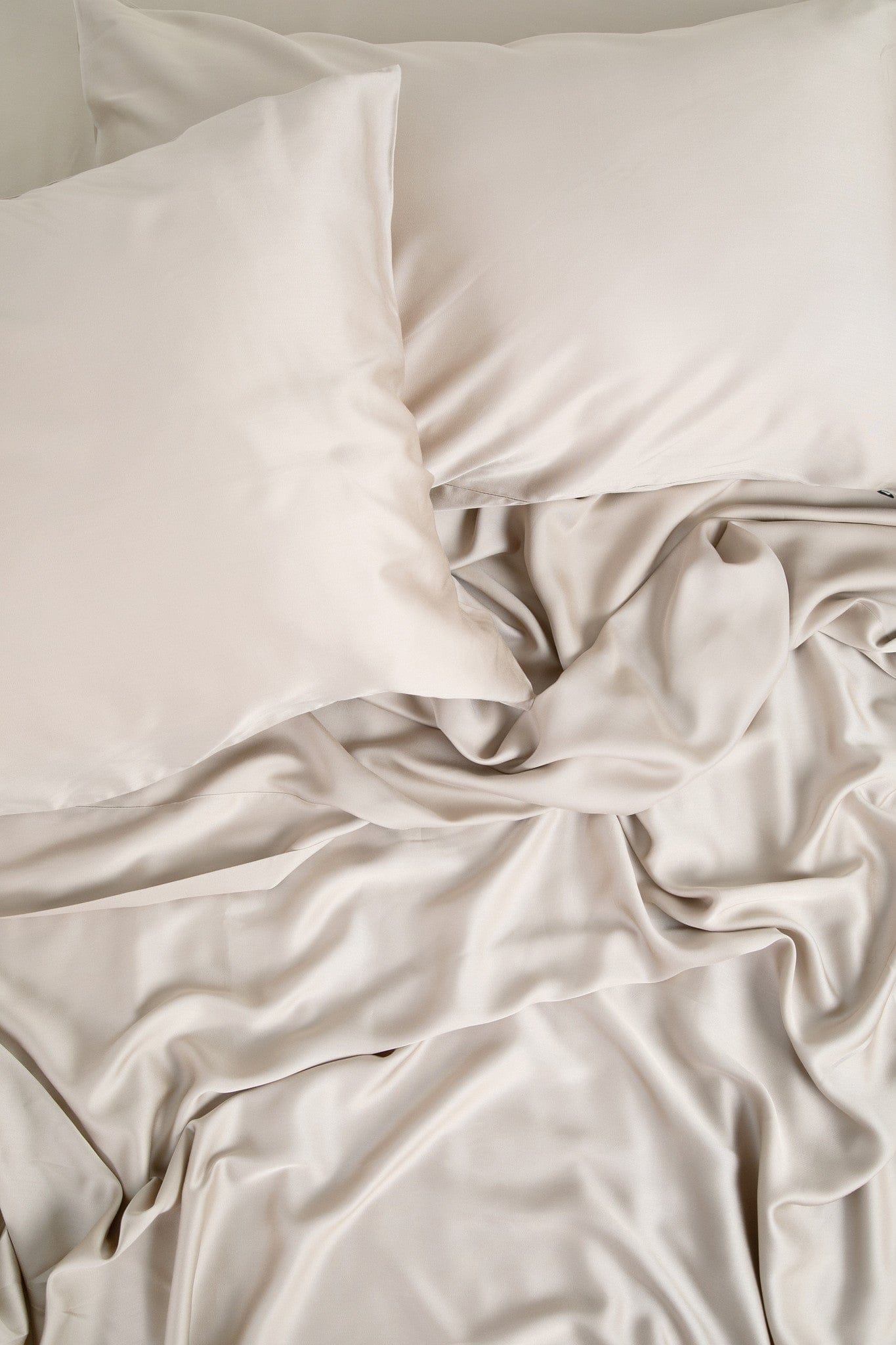 Close up of the Bamboo Sateen Sheet Set in Sand Stone shown on a bed