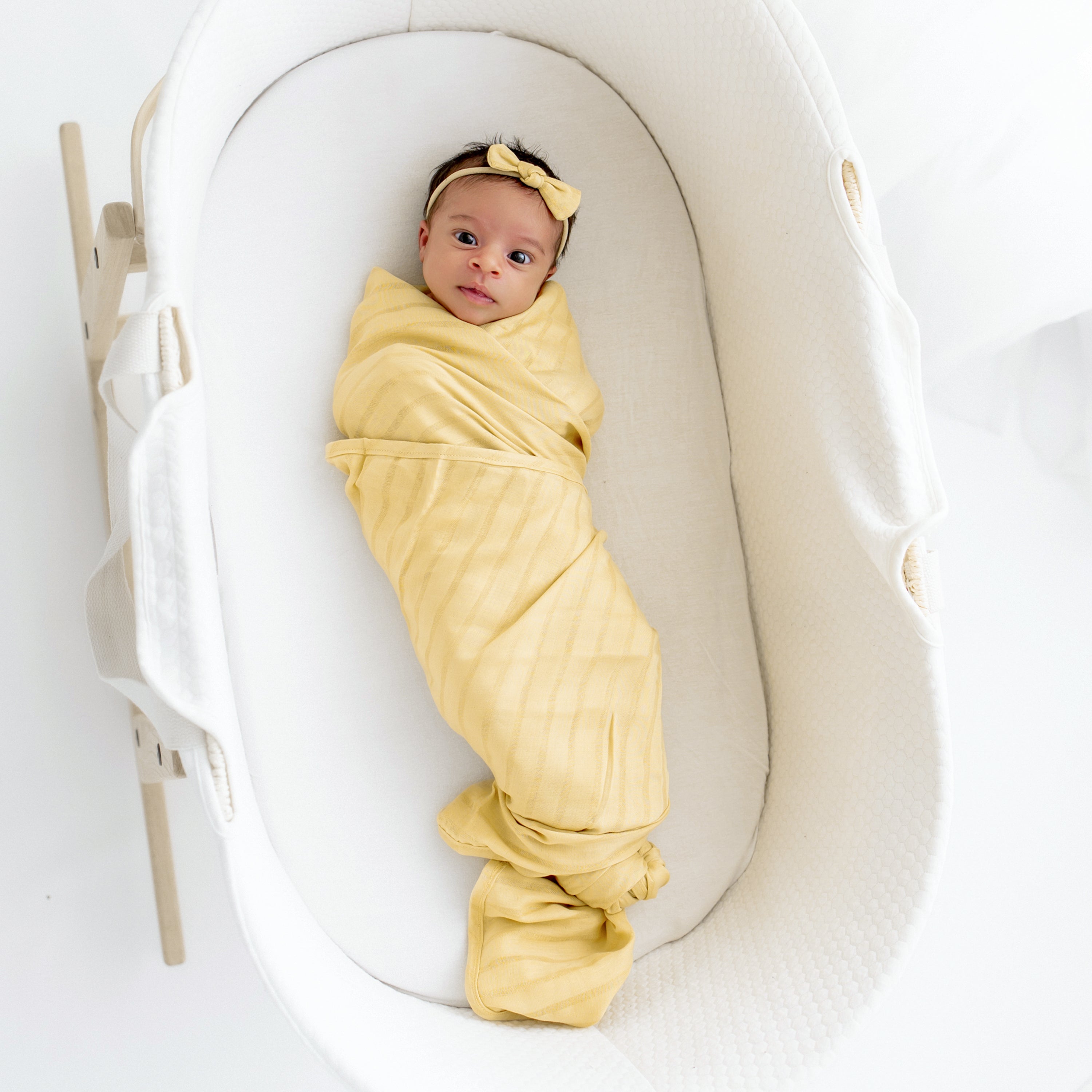 Newborn wrapped in Breathable Bamboo Muslin Swaddle Blanket in Sandcastle
