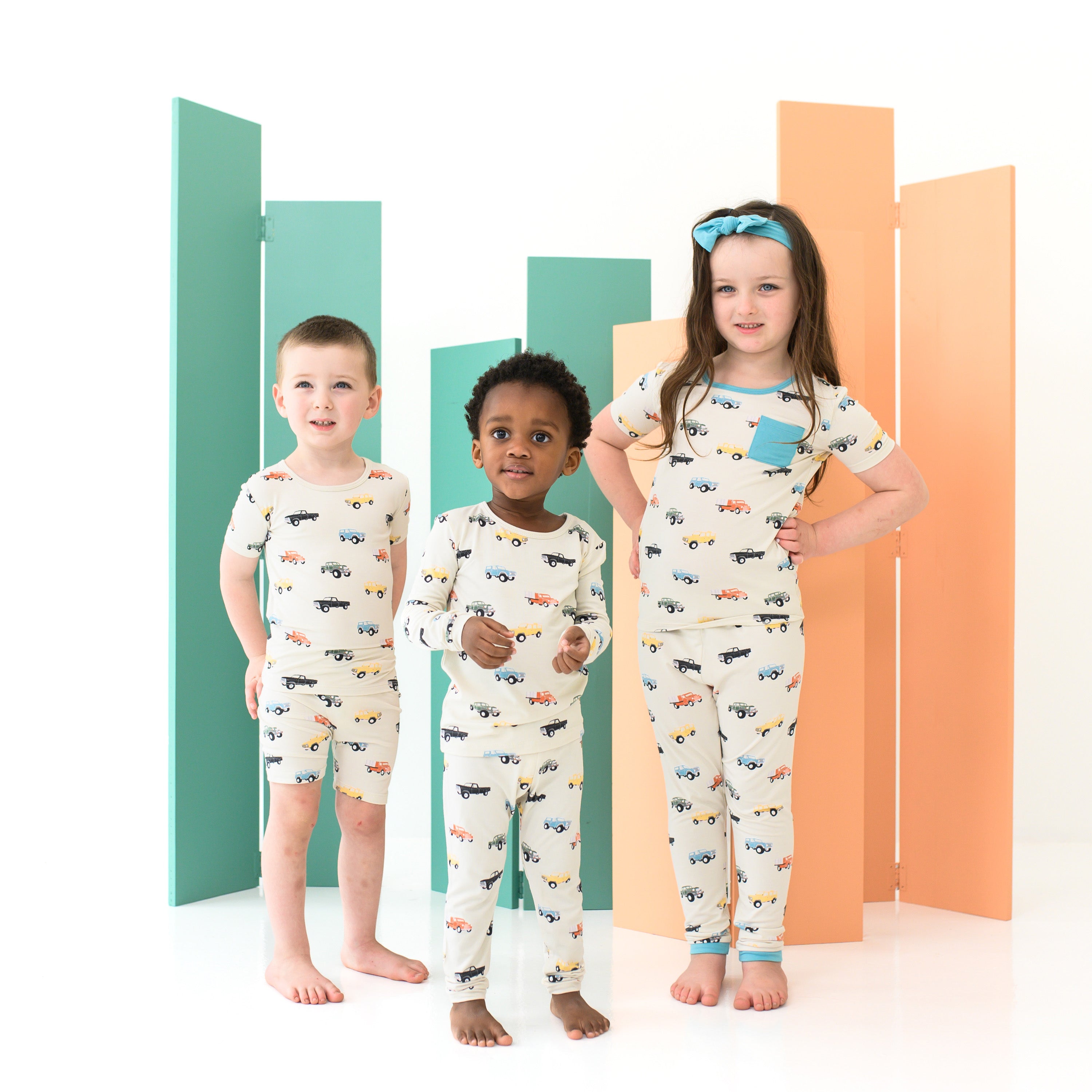 Children wearing Kids Pajamas in Vintage Truck pattern