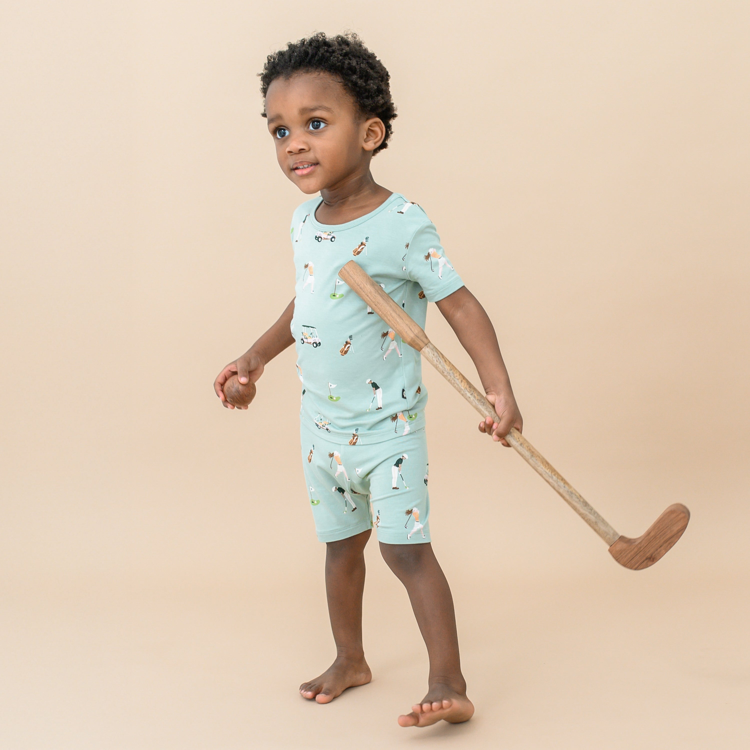 Toddler wearing Short Sleeve Bamboo Kids Pajamas in Golf