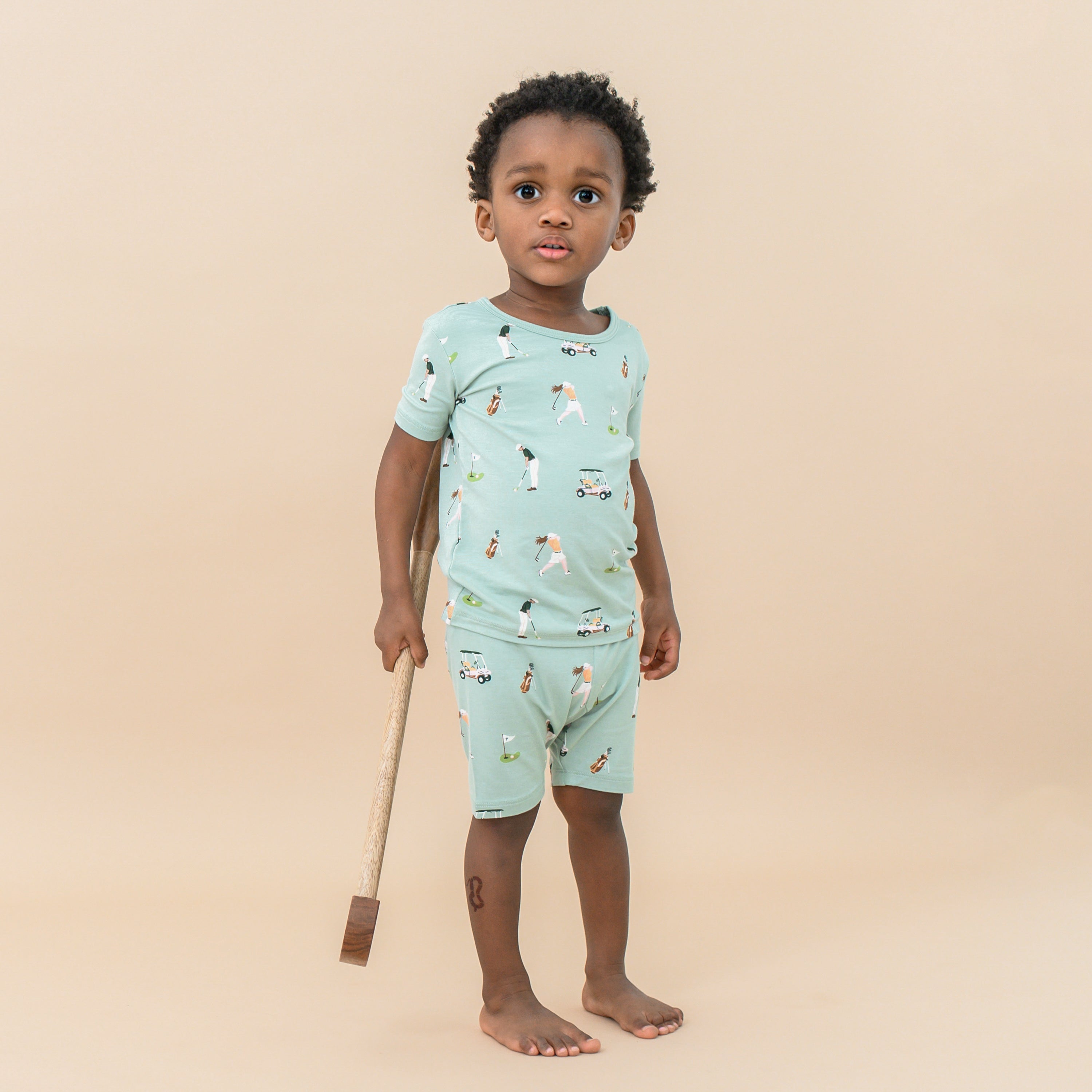 Toddler wearing Short Sleeve Pajamas in Golf print