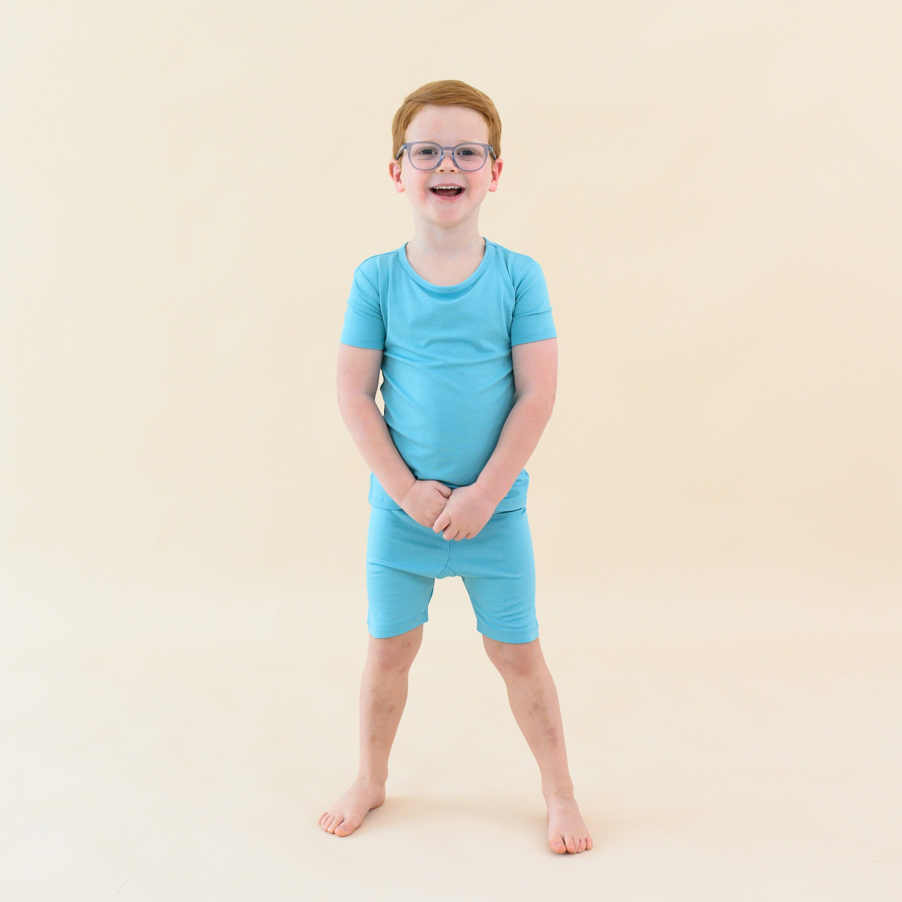 toddler wearing short sleeve pajamas in makai