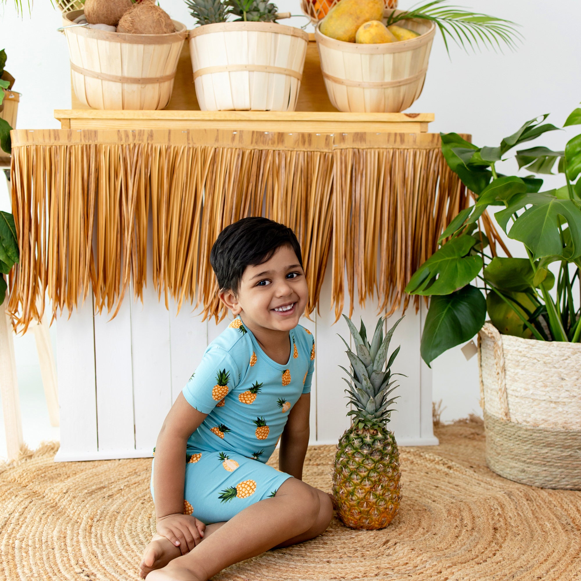 Child wearing Short Sleeve Bamboo Kids Pajamas in Pineapple