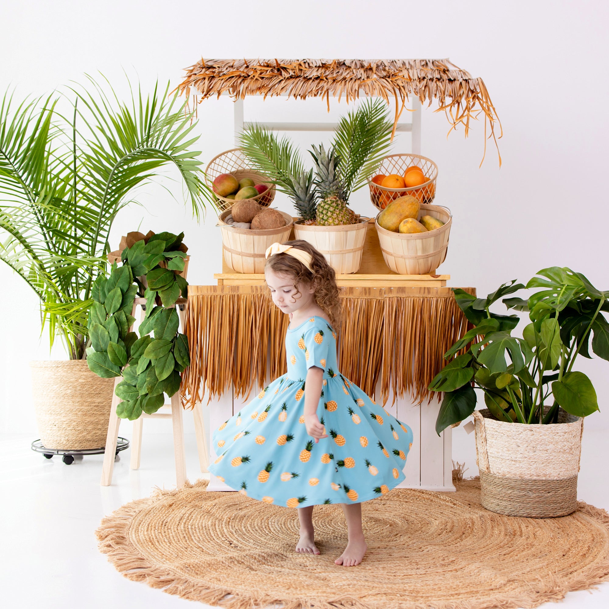 toddler twirling in Twirl Dress in Pineapple