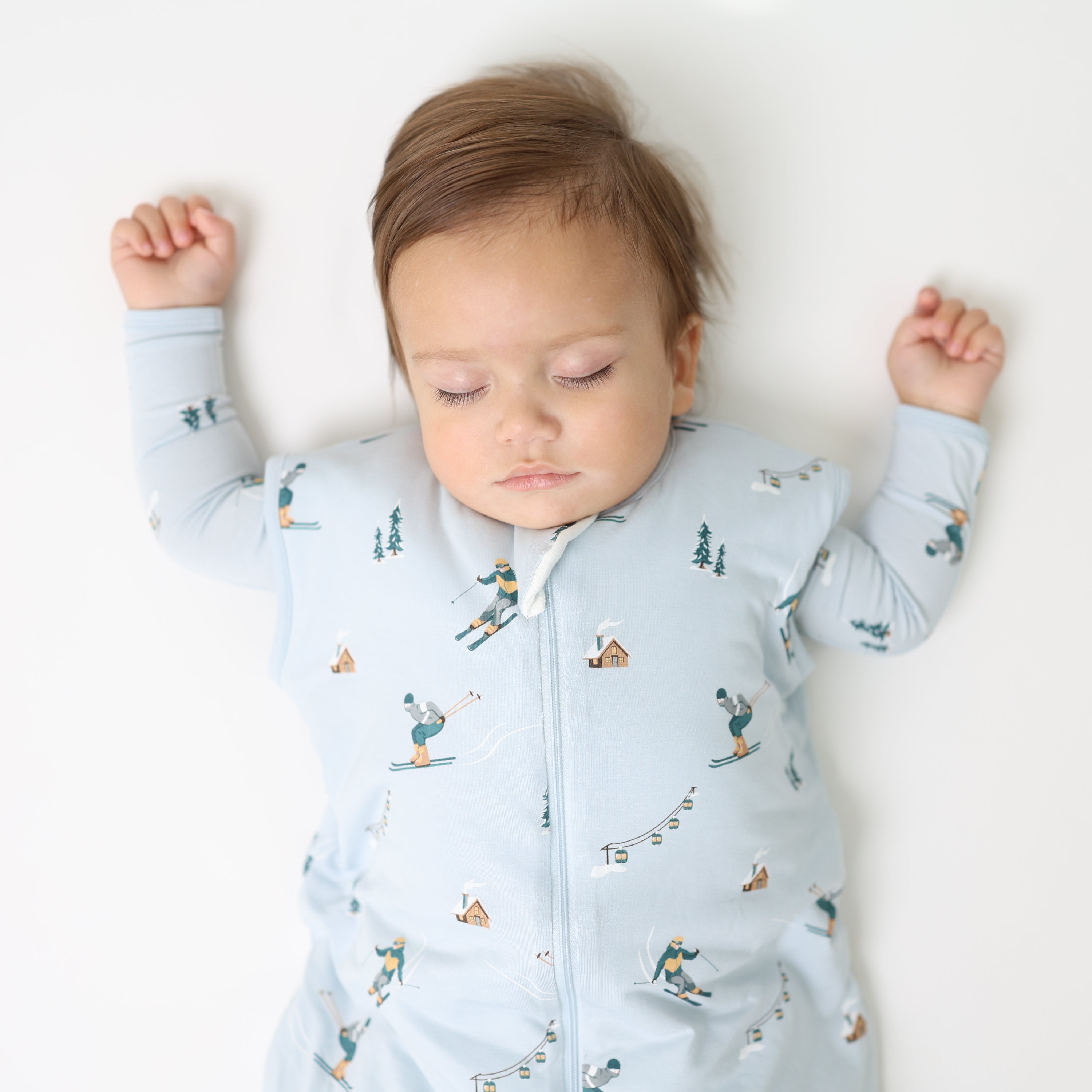 Close up of sleeping toddler wearing the Sleep Bag Walker in Ski 1.0