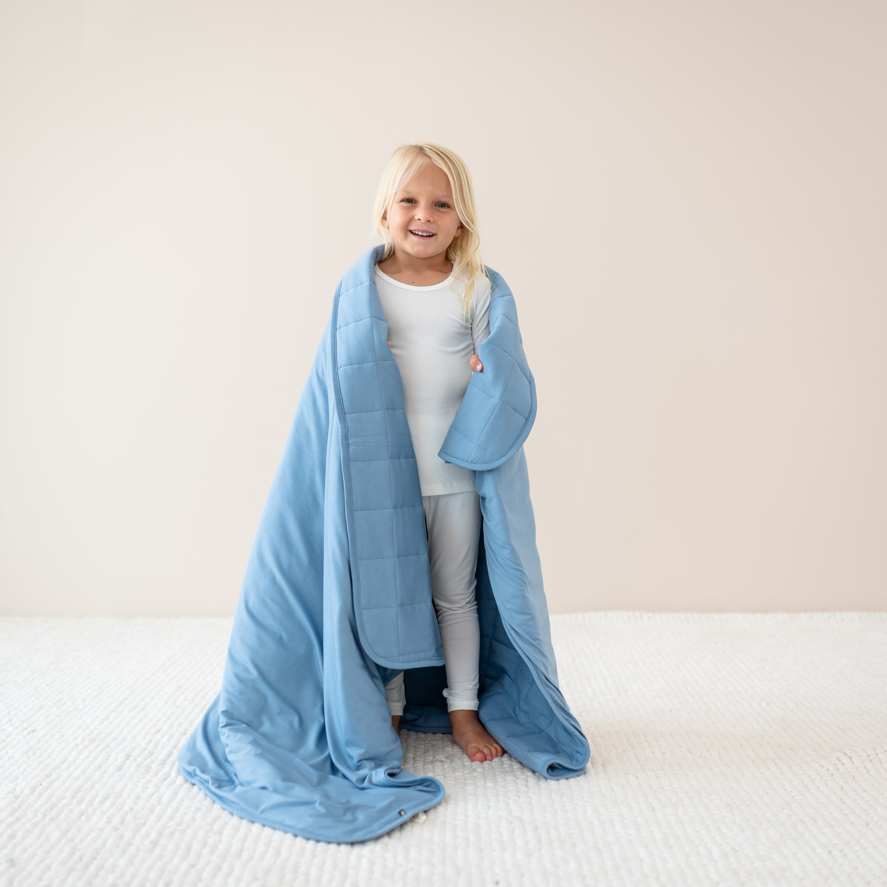Child in Cloud Pajamas wrapped in Youth Blanket in Slate 1.0
