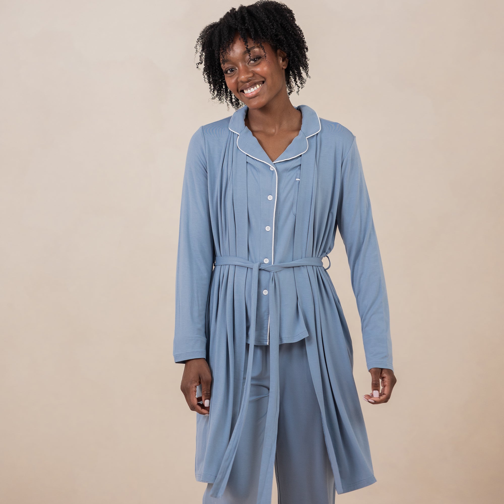 Female model wearing the Women's Lounge Robe in Slate showed tied in the front with matching long sleeve women's pajama set on underneath