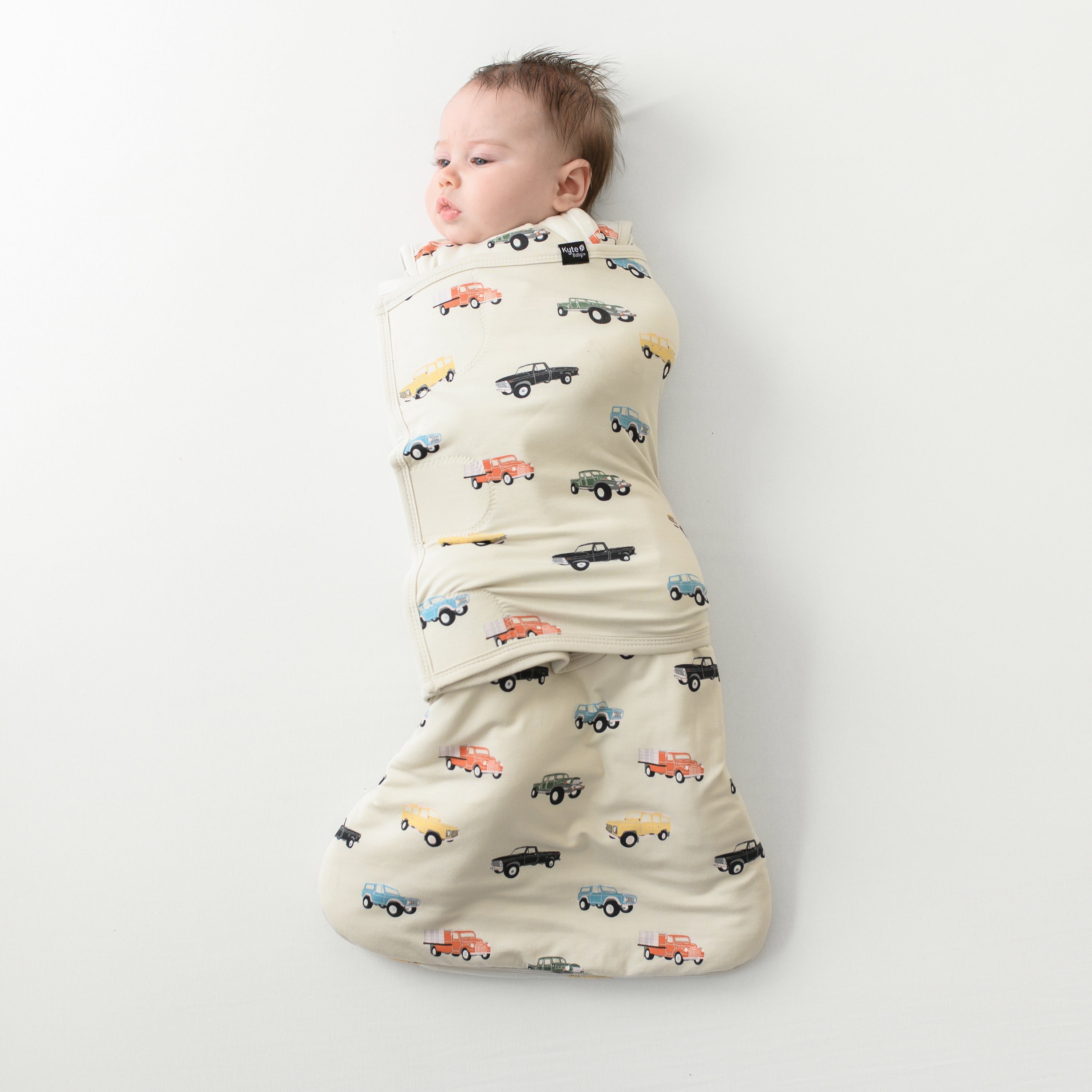 Baby wearing Bamboo Sleep Bag Swaddler in Vintage Truck TOG 1.0