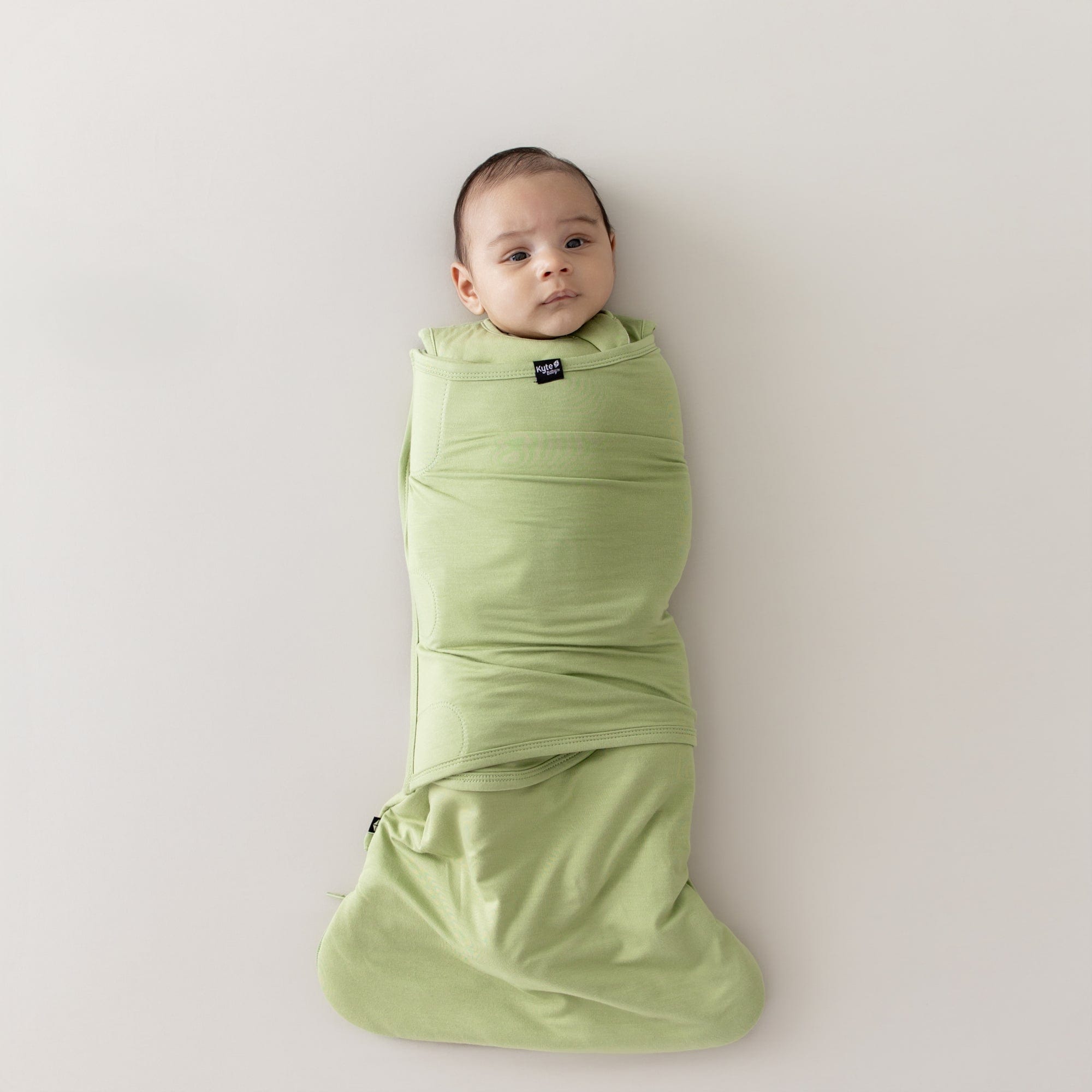 Baby swaddled in the Sleep Bag Swaddler in Honu 1.0