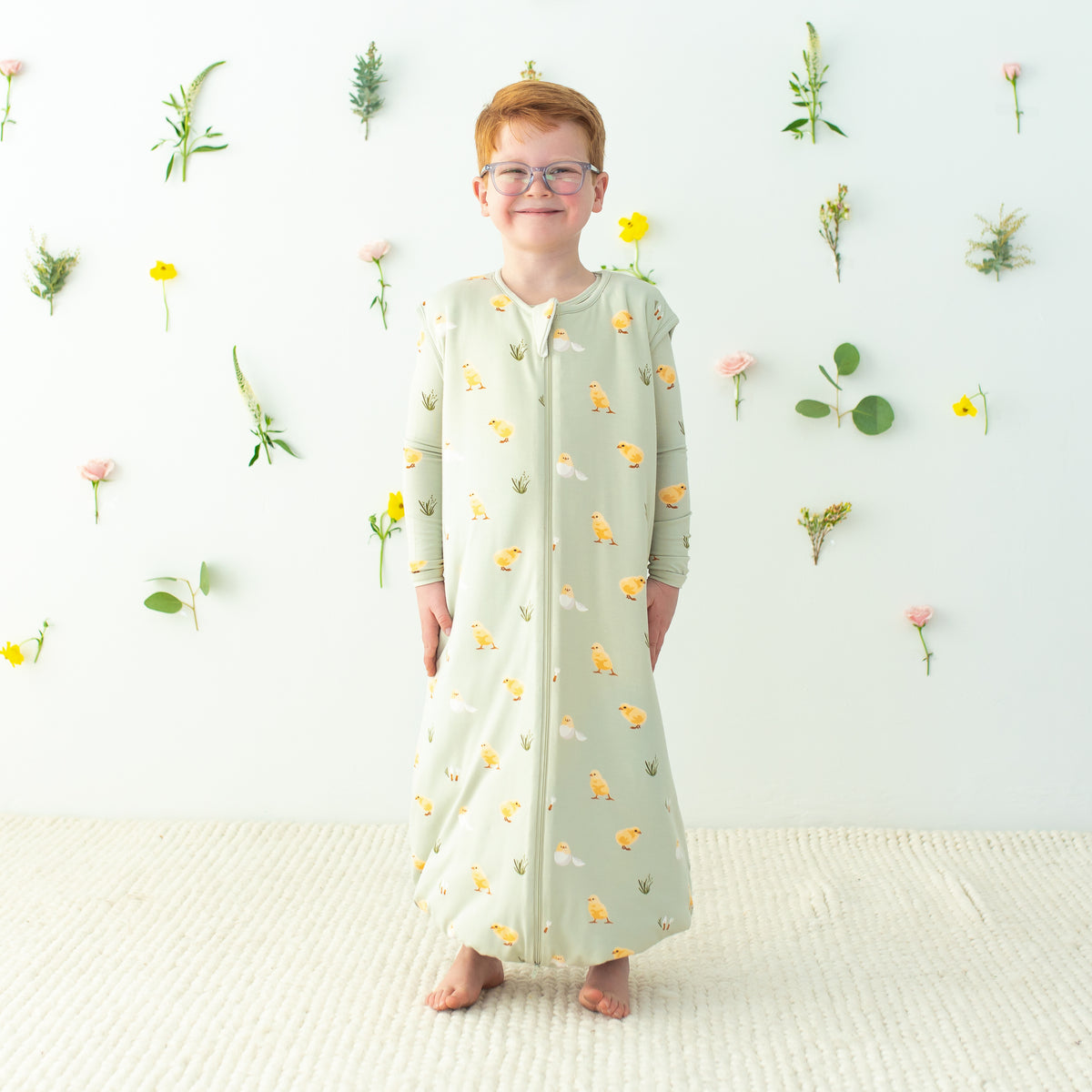 Child modeling Sleep Bag Walker in Aloe Chick TOG 1.0