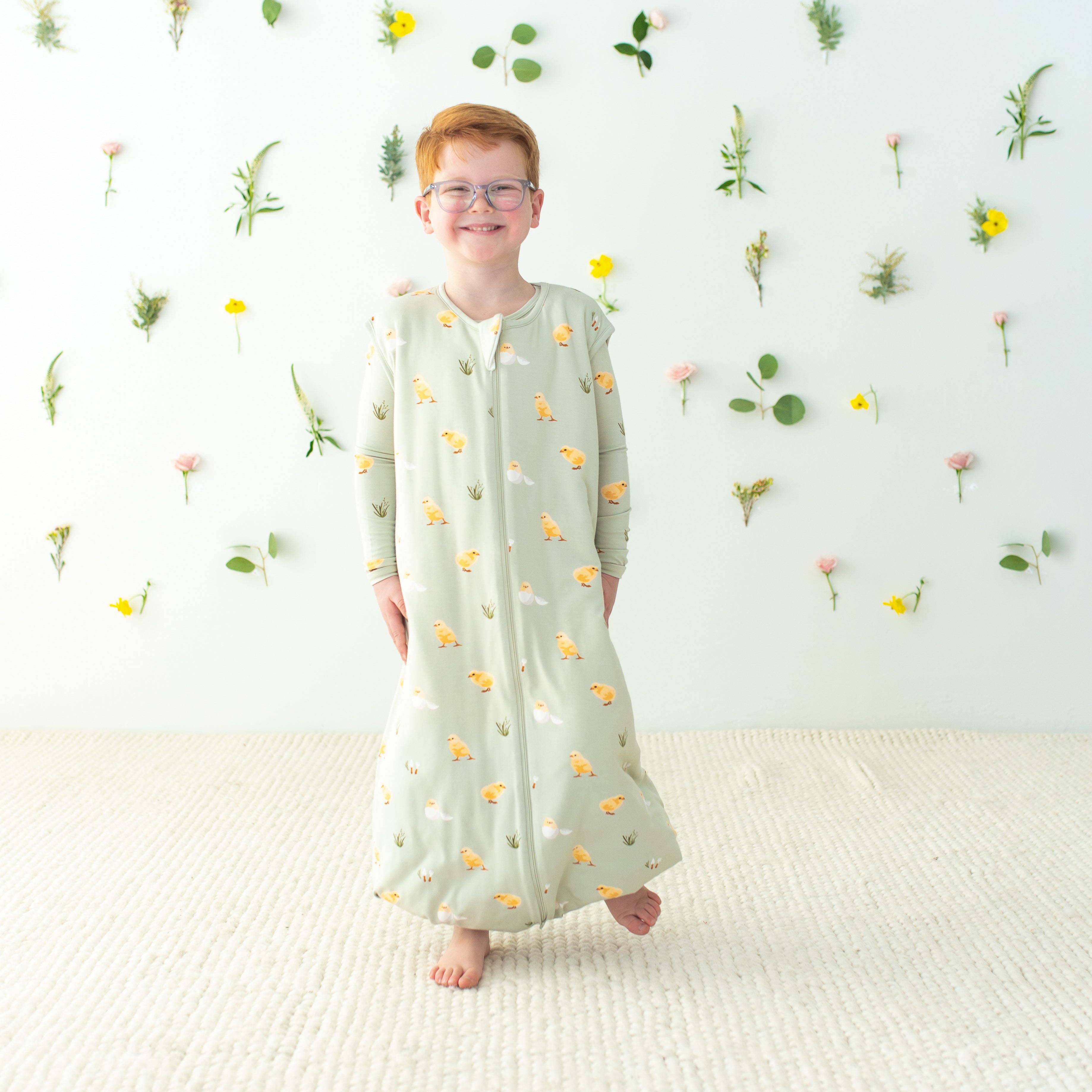 Child wearing Easter Sleep Bag Walker in Aloe Chick 1.0