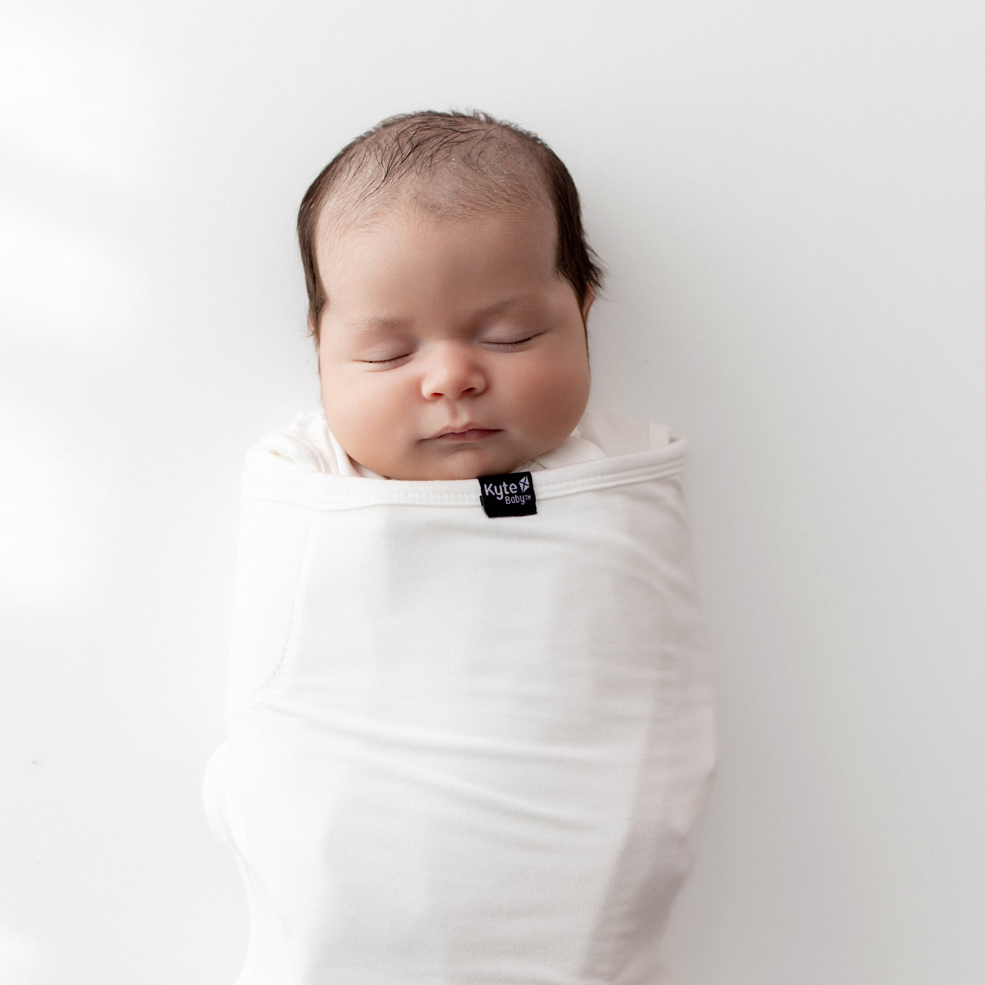 Close up of Baby swaddled sleeping in Sleep Bag Swaddler in Cloud 0.5