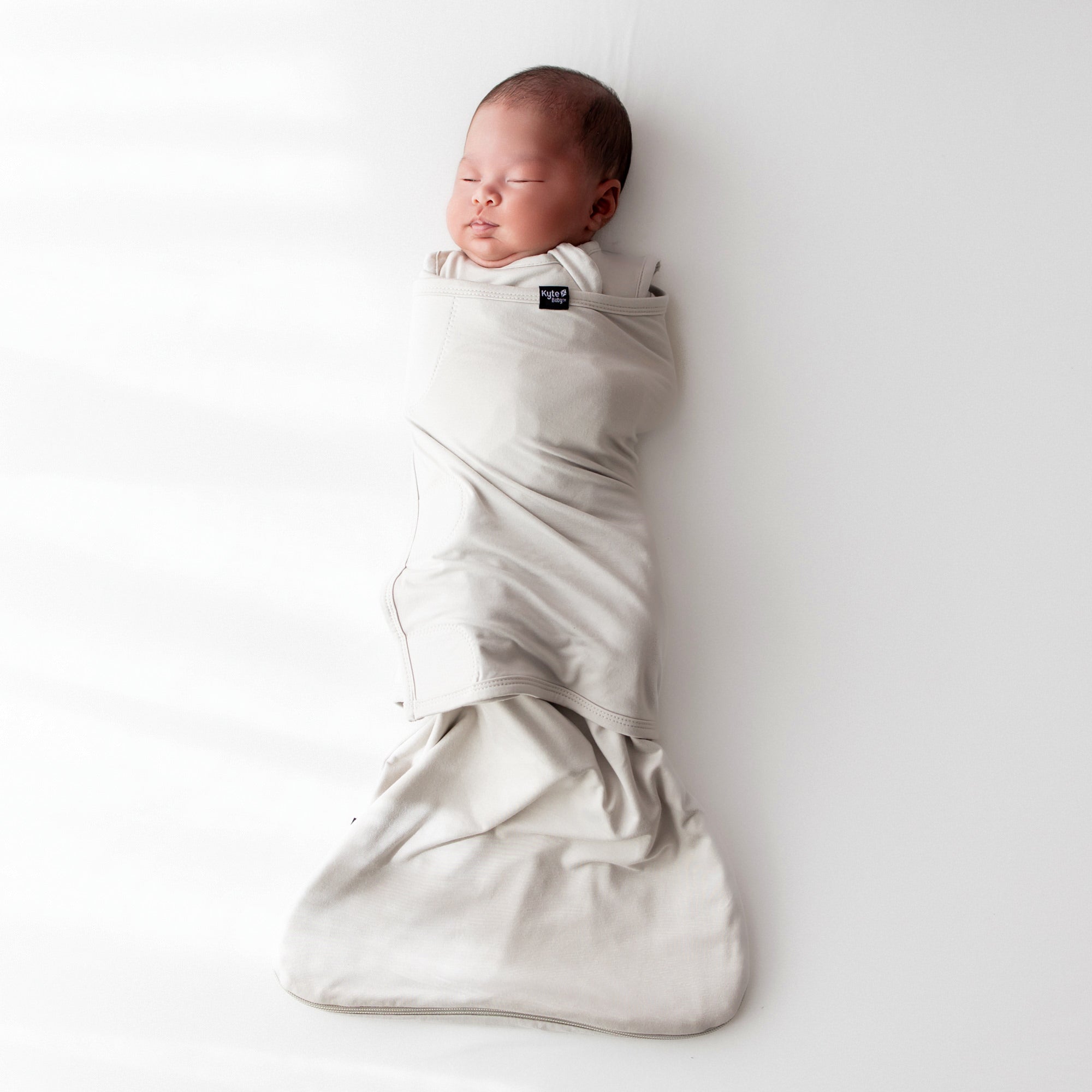 Newborn swaddled in bamboo Sleep Bag Swaddler in Oat 0.5