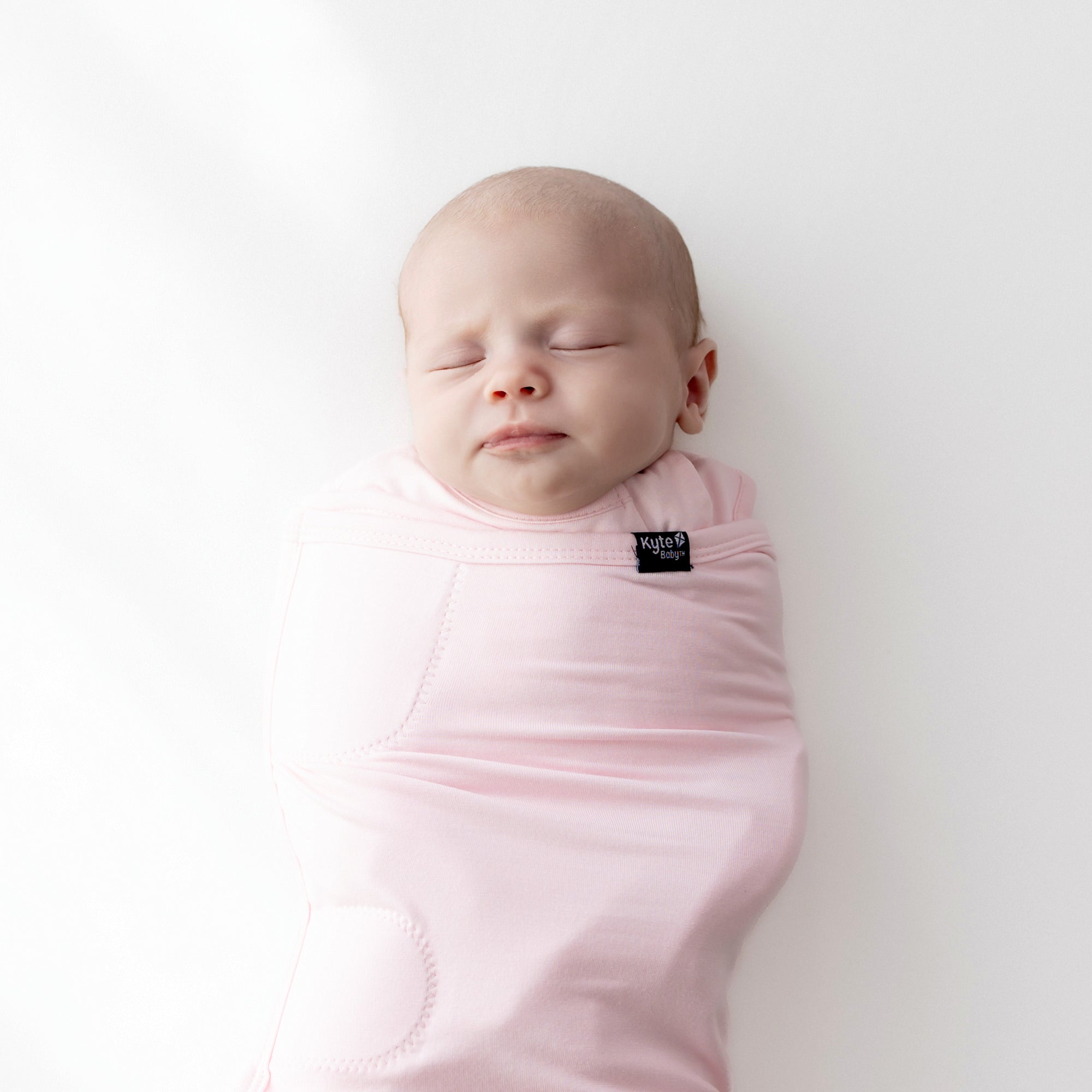 Baby asleep in Sleep Bag Swaddler in Sakura 0.5 close up