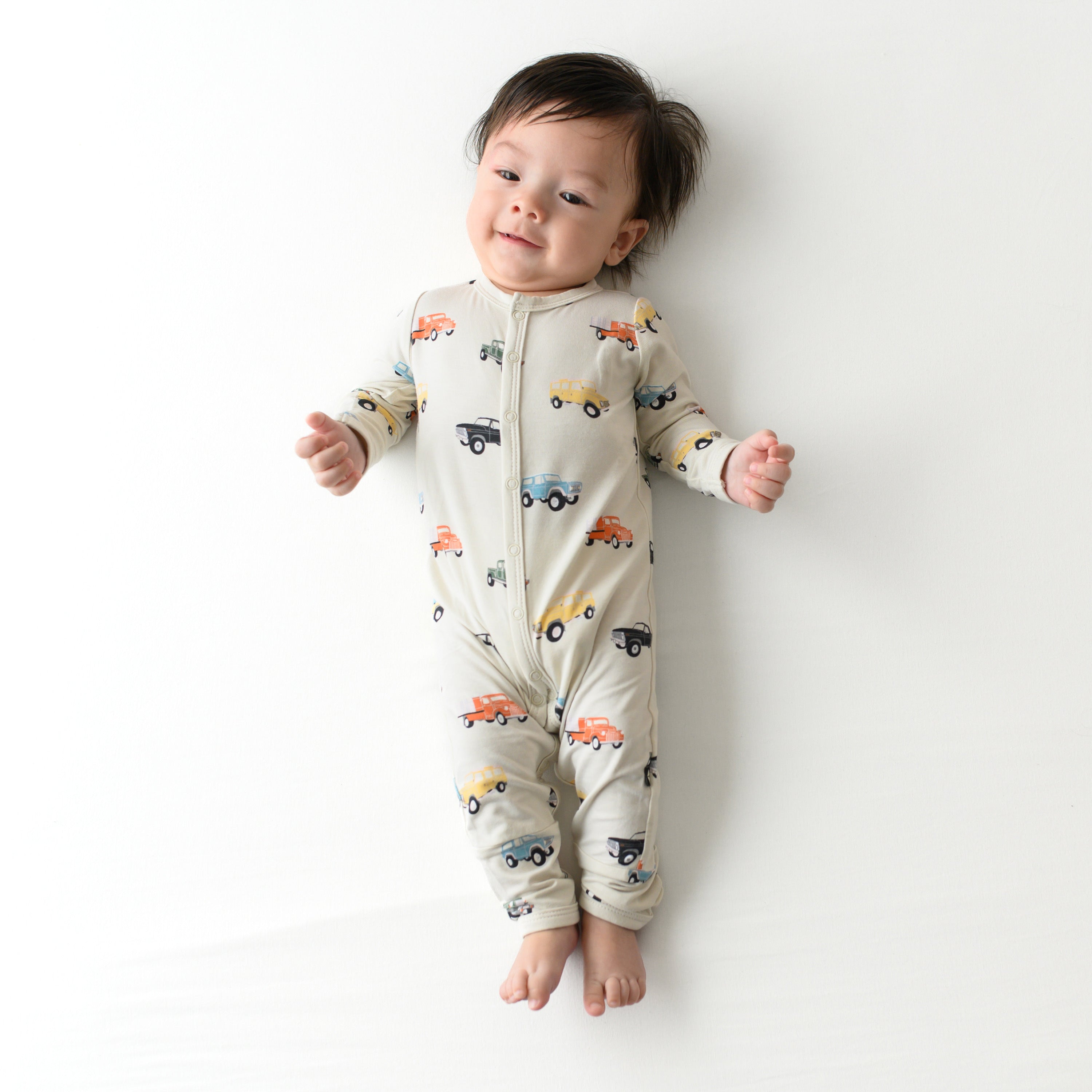 Baby wearing Snap Romper in Vintage Truck