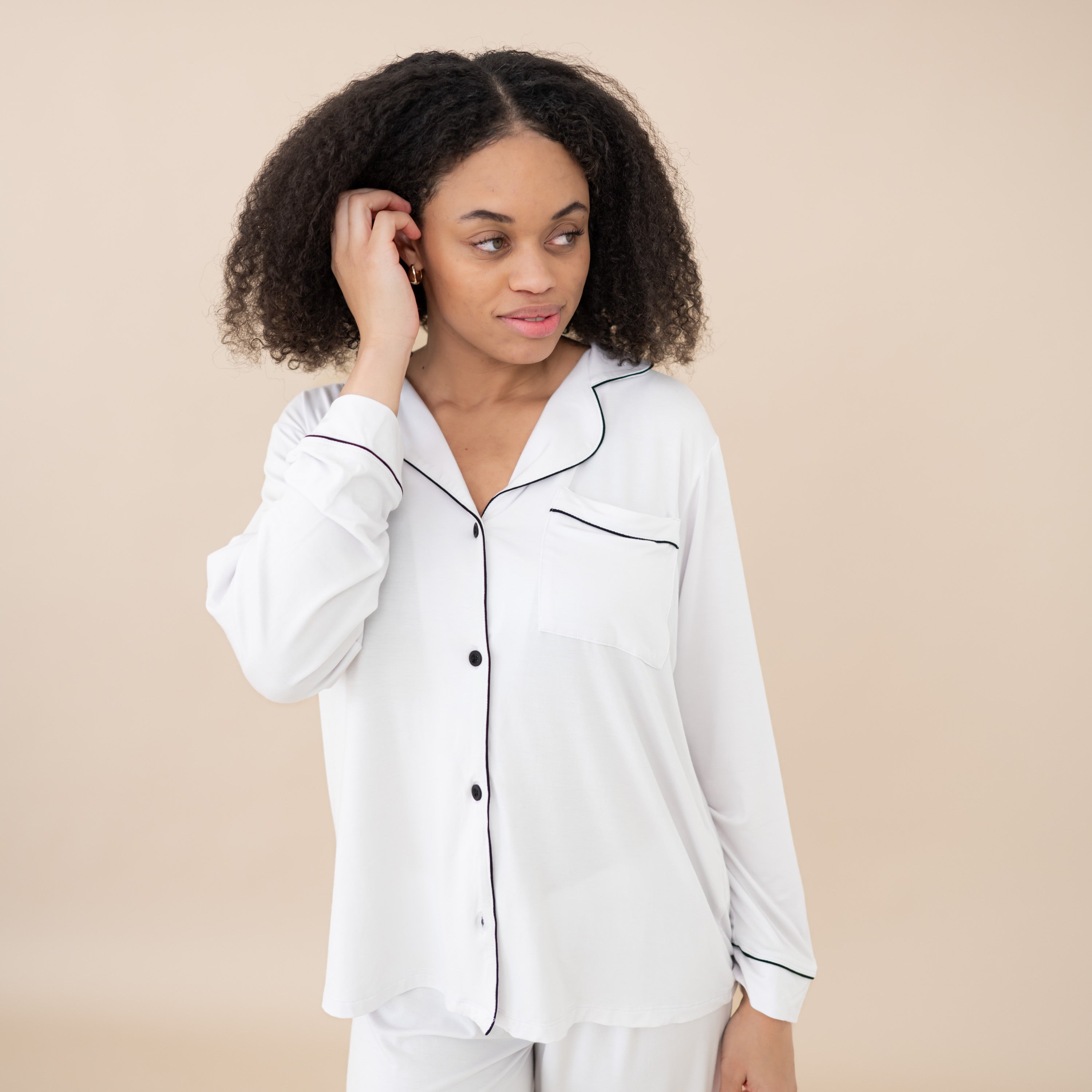 Woman modeling Women's Long Sleeve Pajama Set in Snow with Midnight Trim close up on top