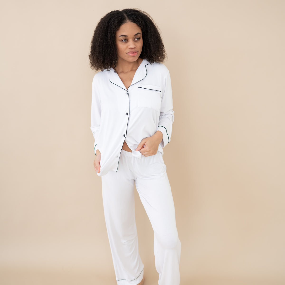 Woman modeling Women's Long Sleeve Pajama Set in Snow with Midnight Trim