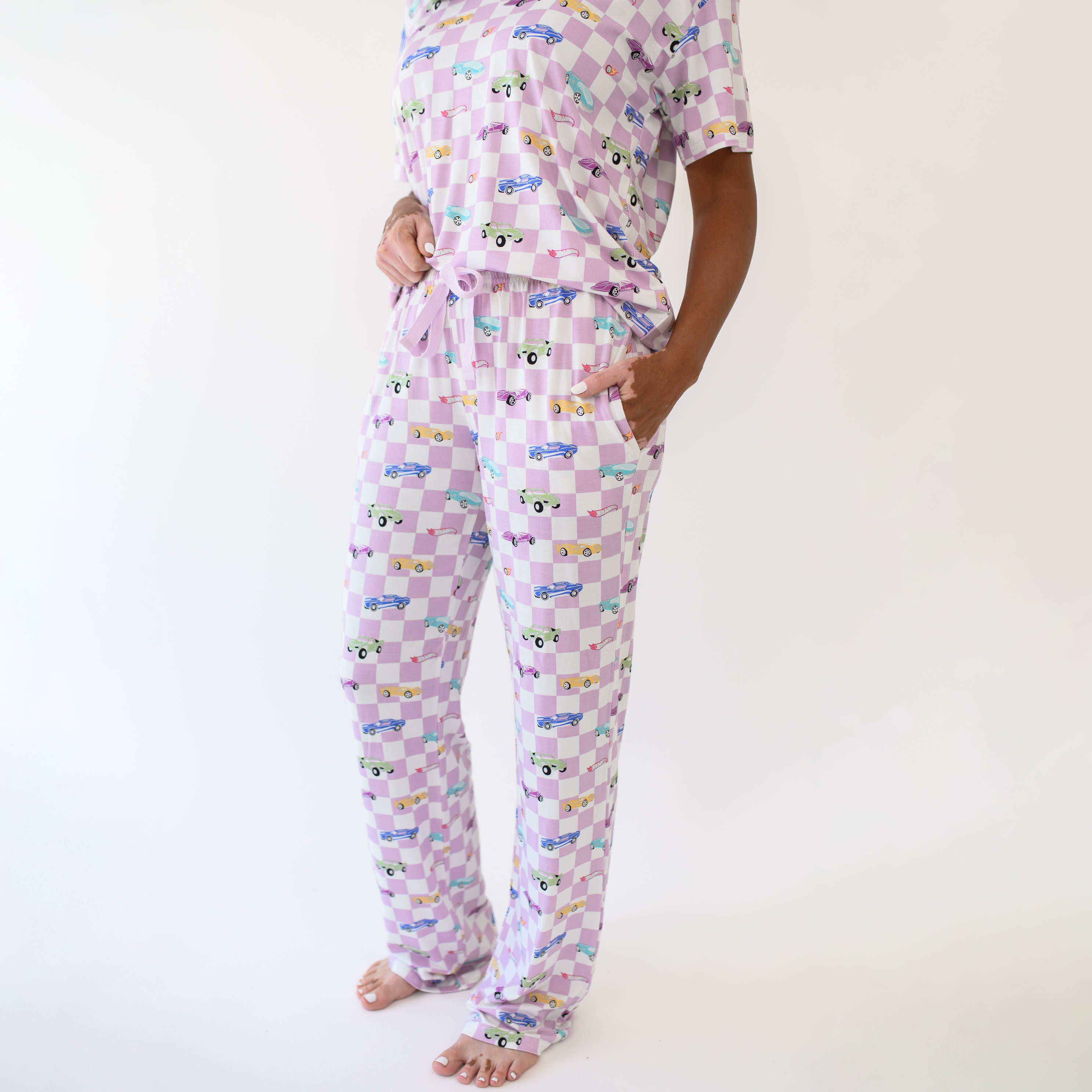 Woman modeling Women's Lounge Pants in Sparkles and Speed showing close up of the pants with pockets