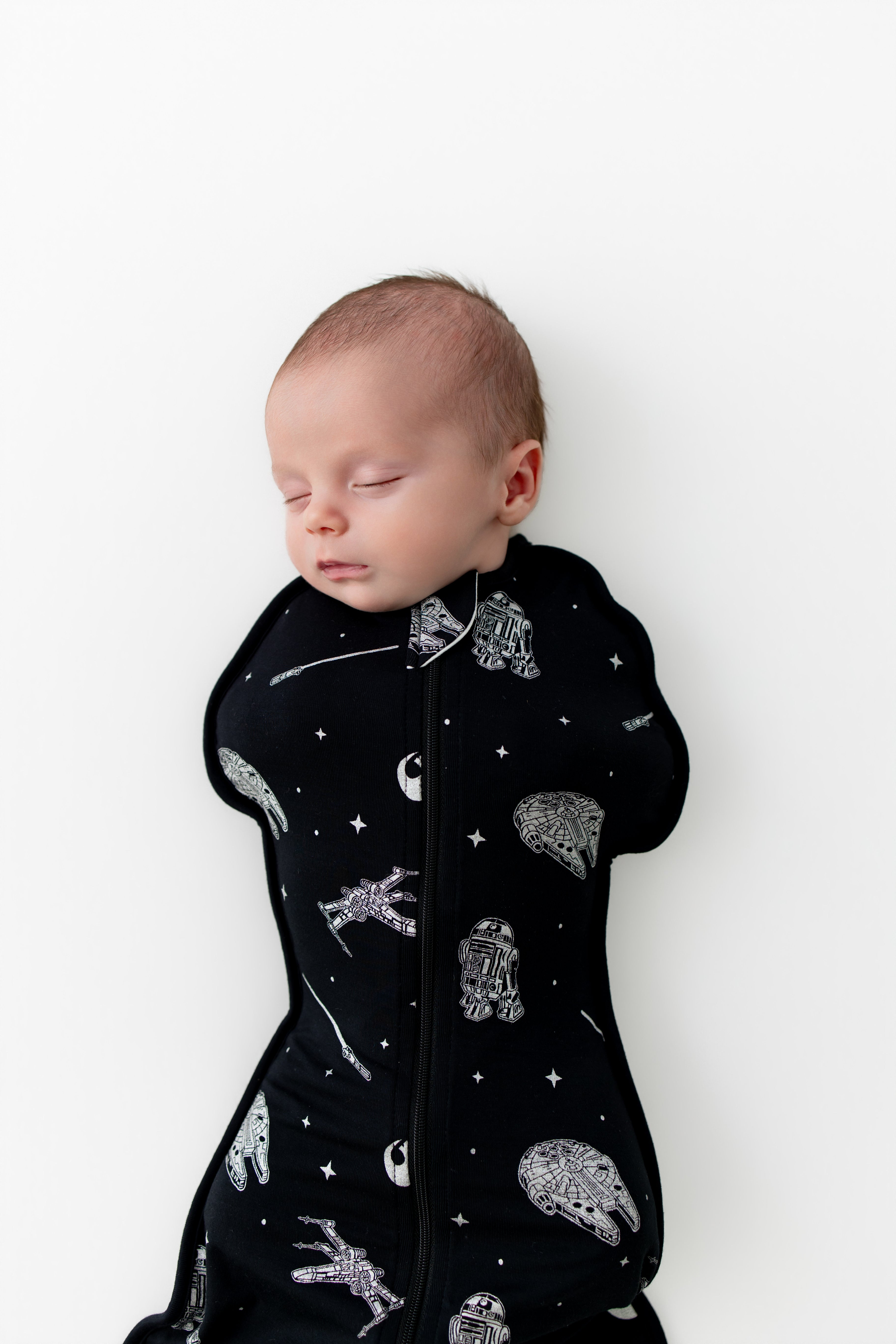 Close up of sleeping newborn wearing the Swaddle Bag in STAR WARS™ 0.5