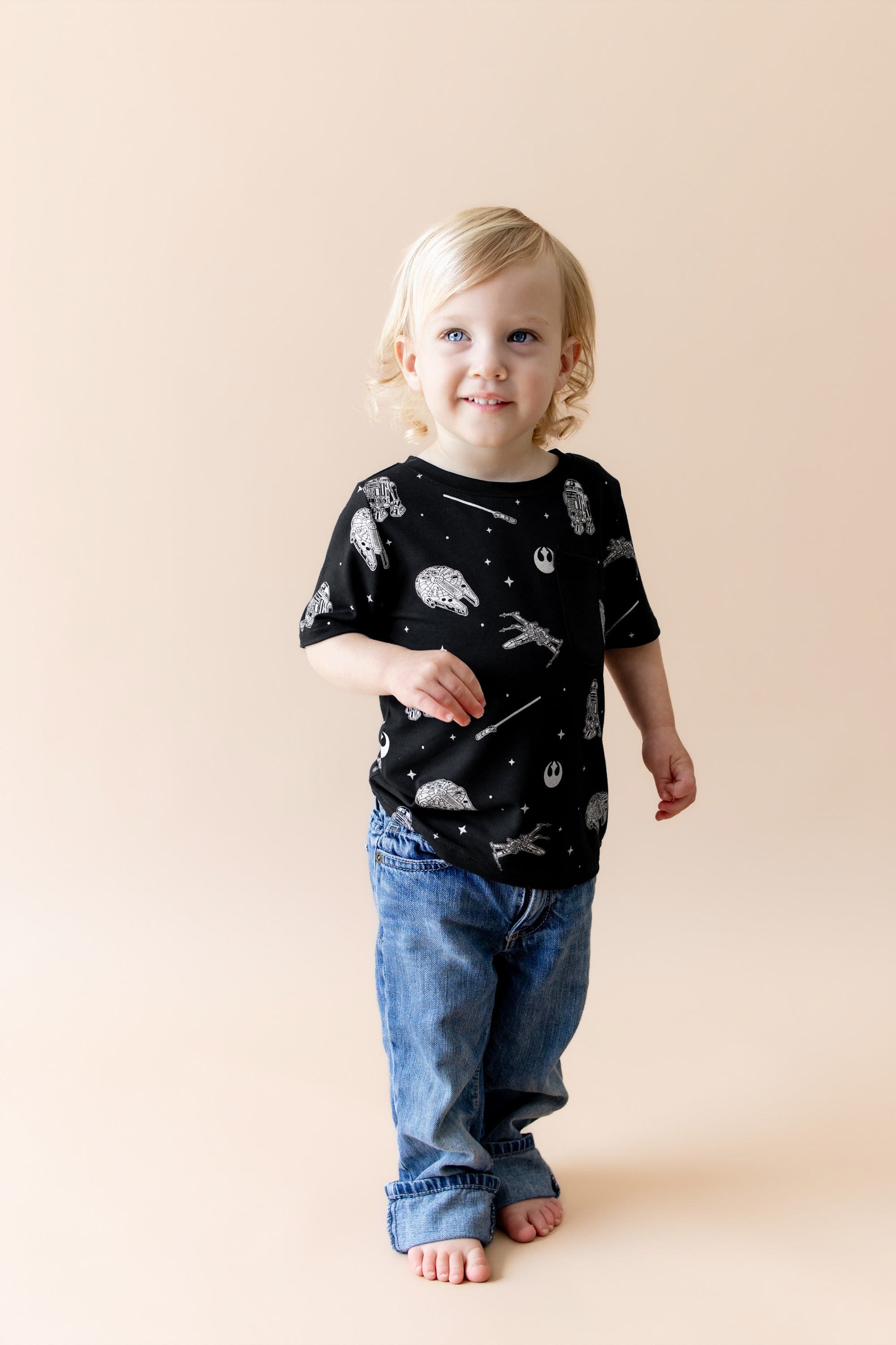 young child wearing the Toddler Crew Neck Tee in STAR WARS™ paired with medium wash jeans