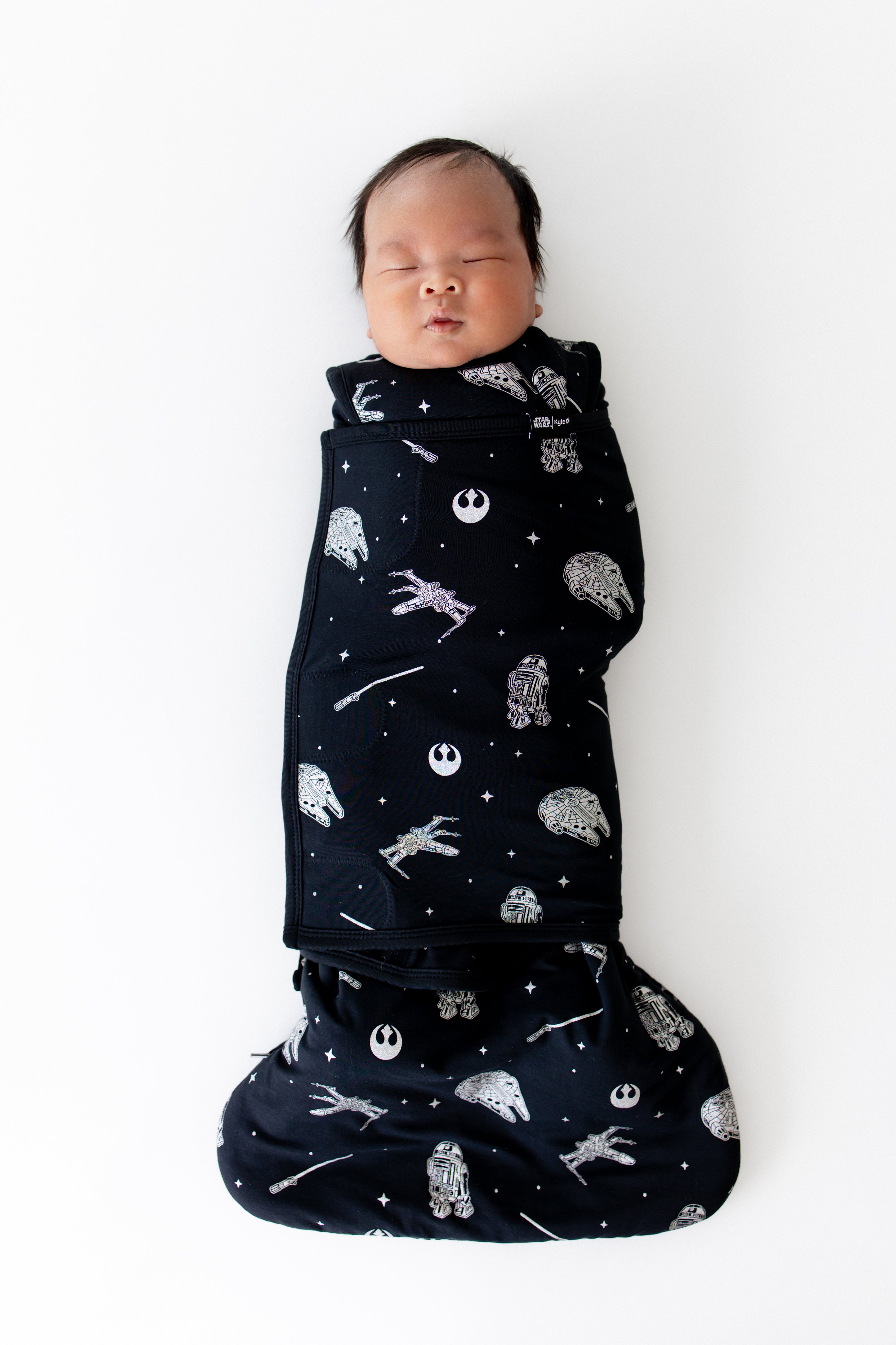 Sleeping newborn swaddled in the Sleep Bag Swaddler in STAR WARS™ 1.0