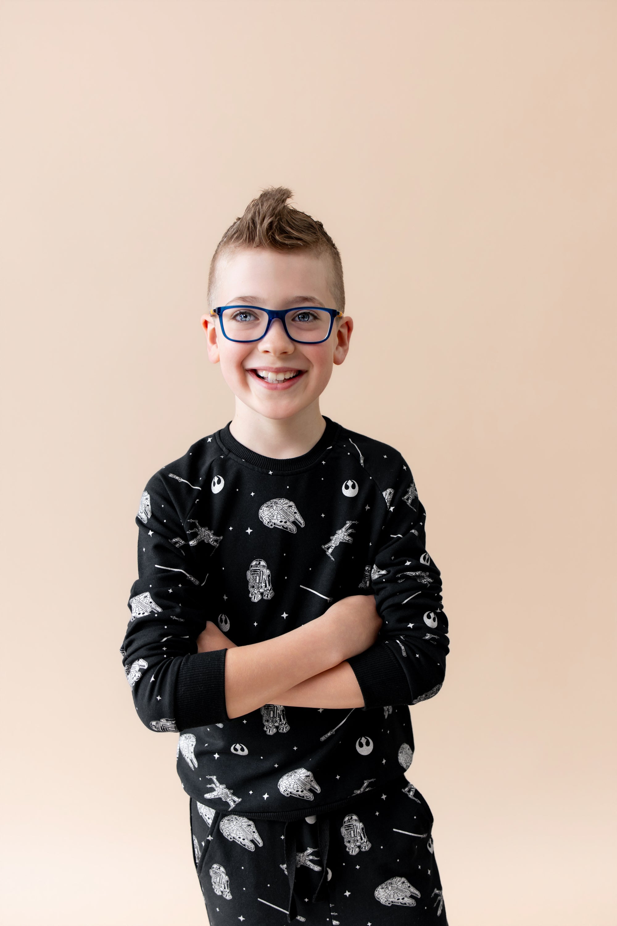 young boy modeling the Long Sleeve Jogger Set in STAR WARS™ with his arms crossed