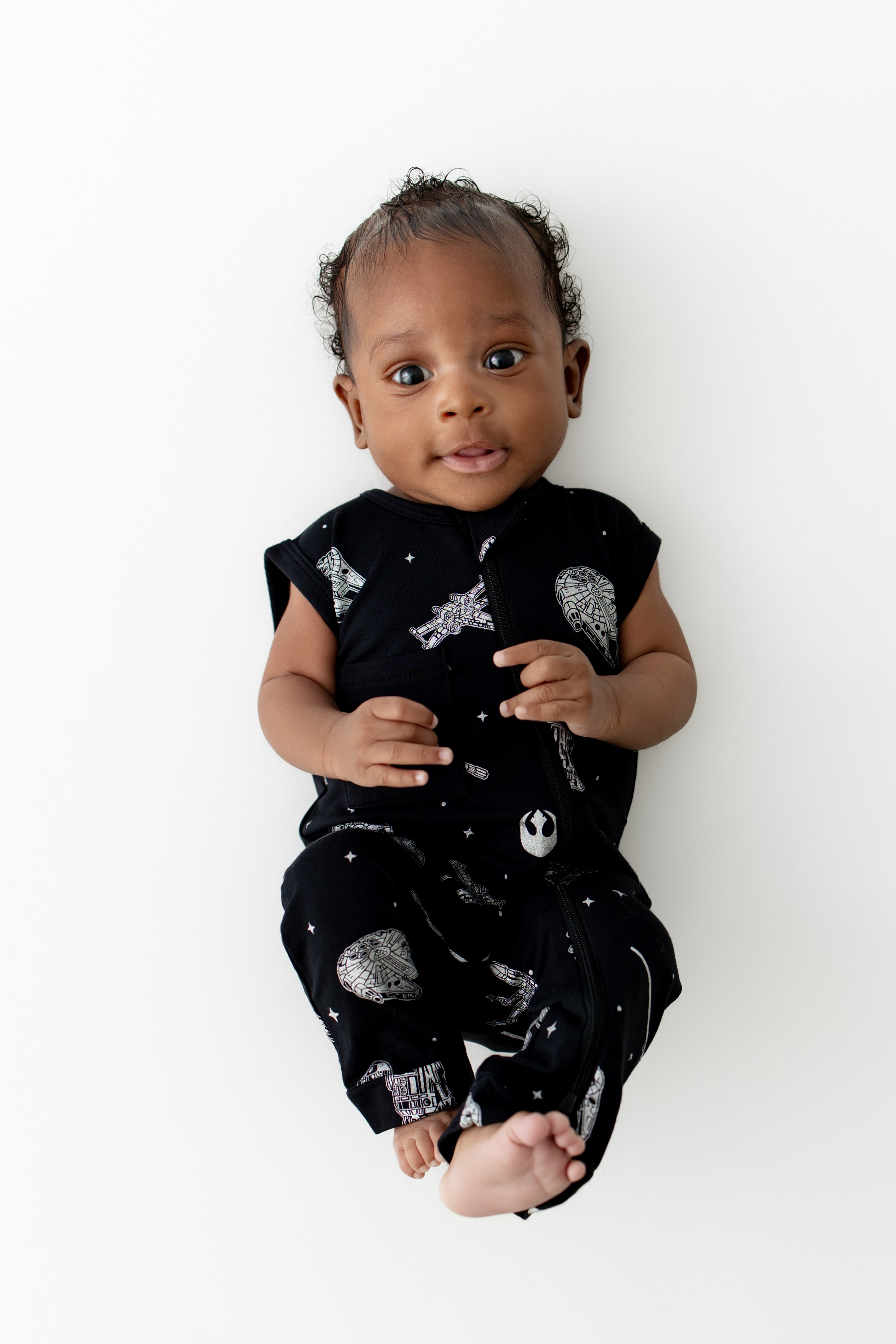 Smiling infant wearing the Zippered Sleeveless Romper in STAR WARS™