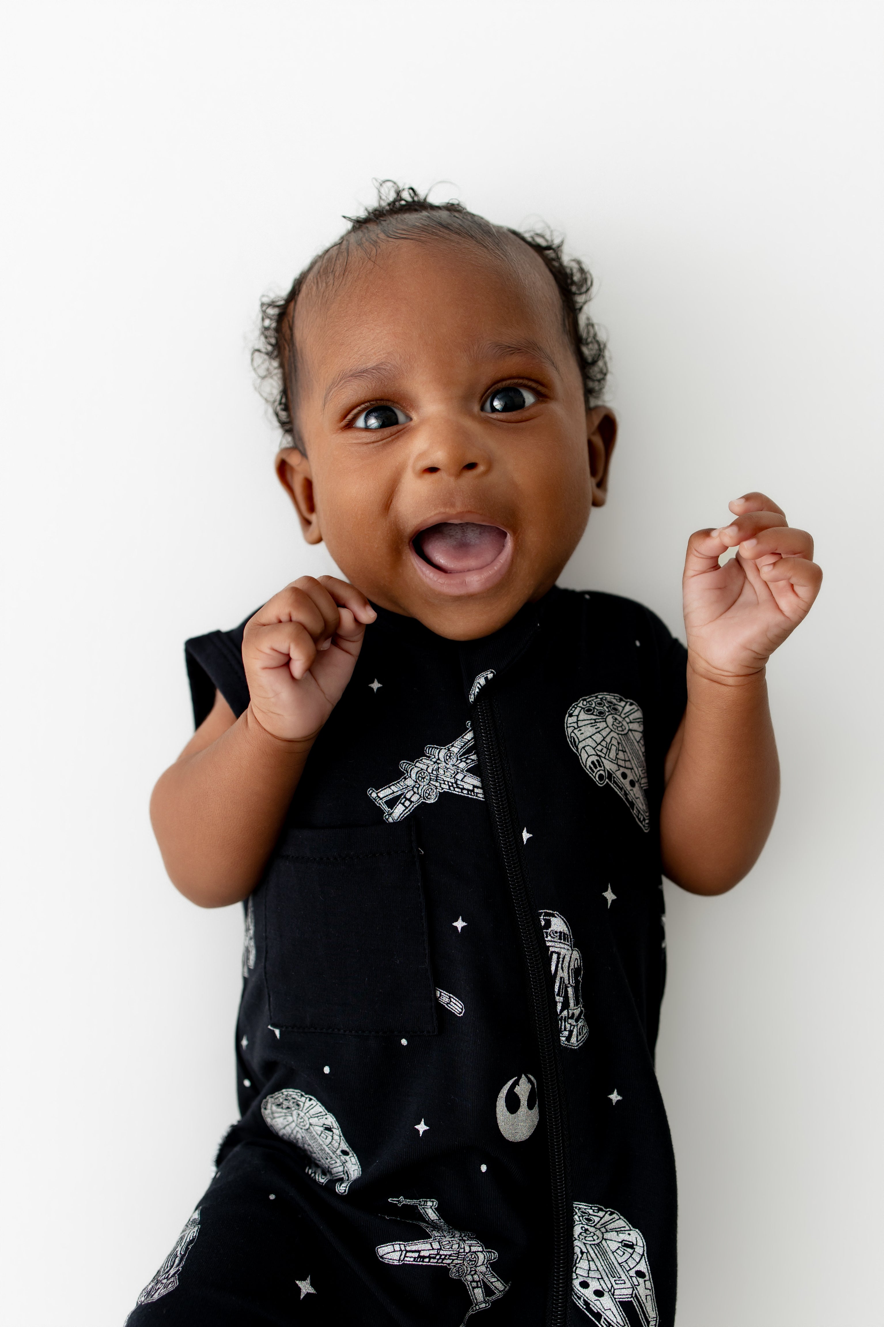 Close up of infant wearing the Zippered Sleeveless Romper in STAR WARS™