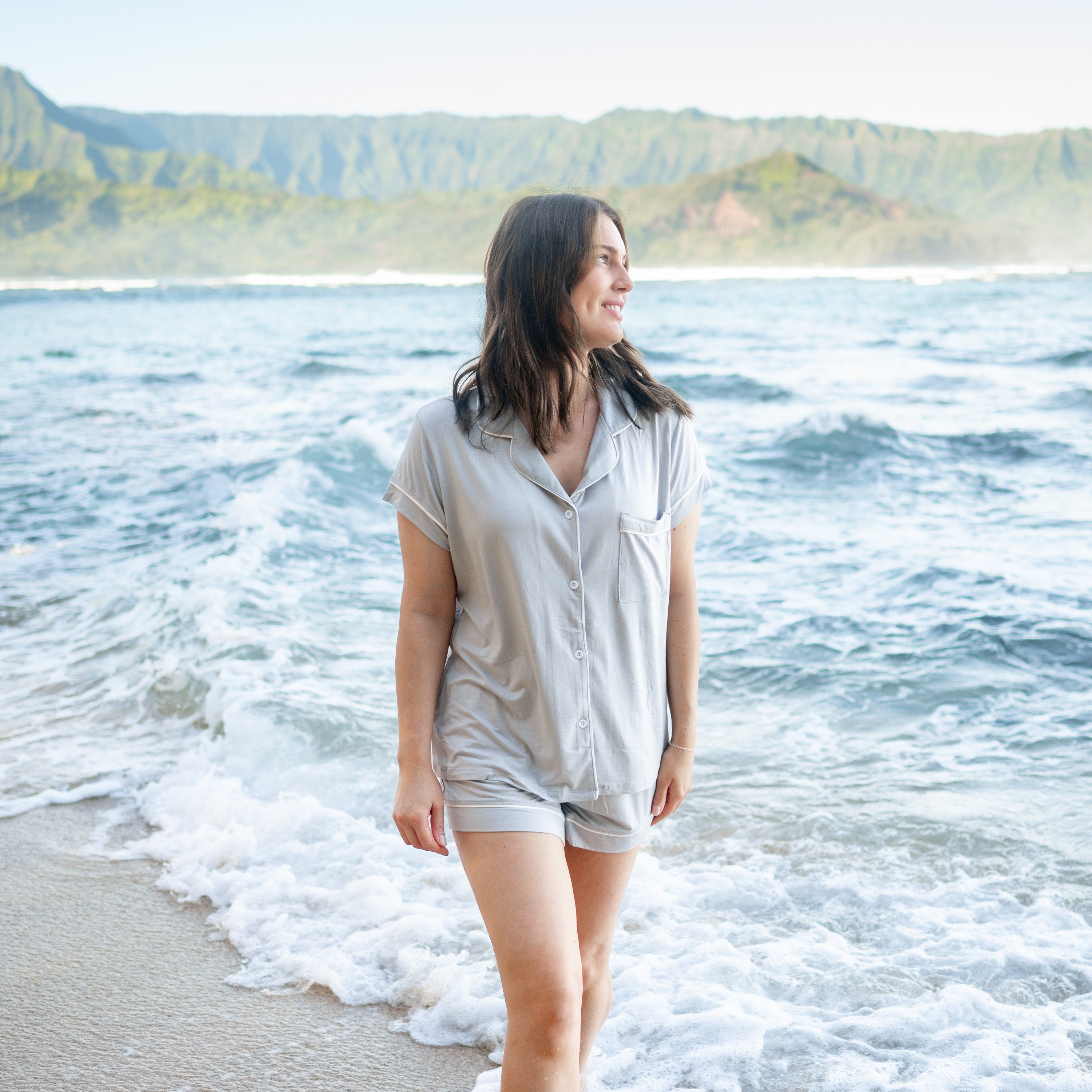 Woman modeling Women’s Short Sleeve Pajama Set in Storm with Cloud Trim on beach