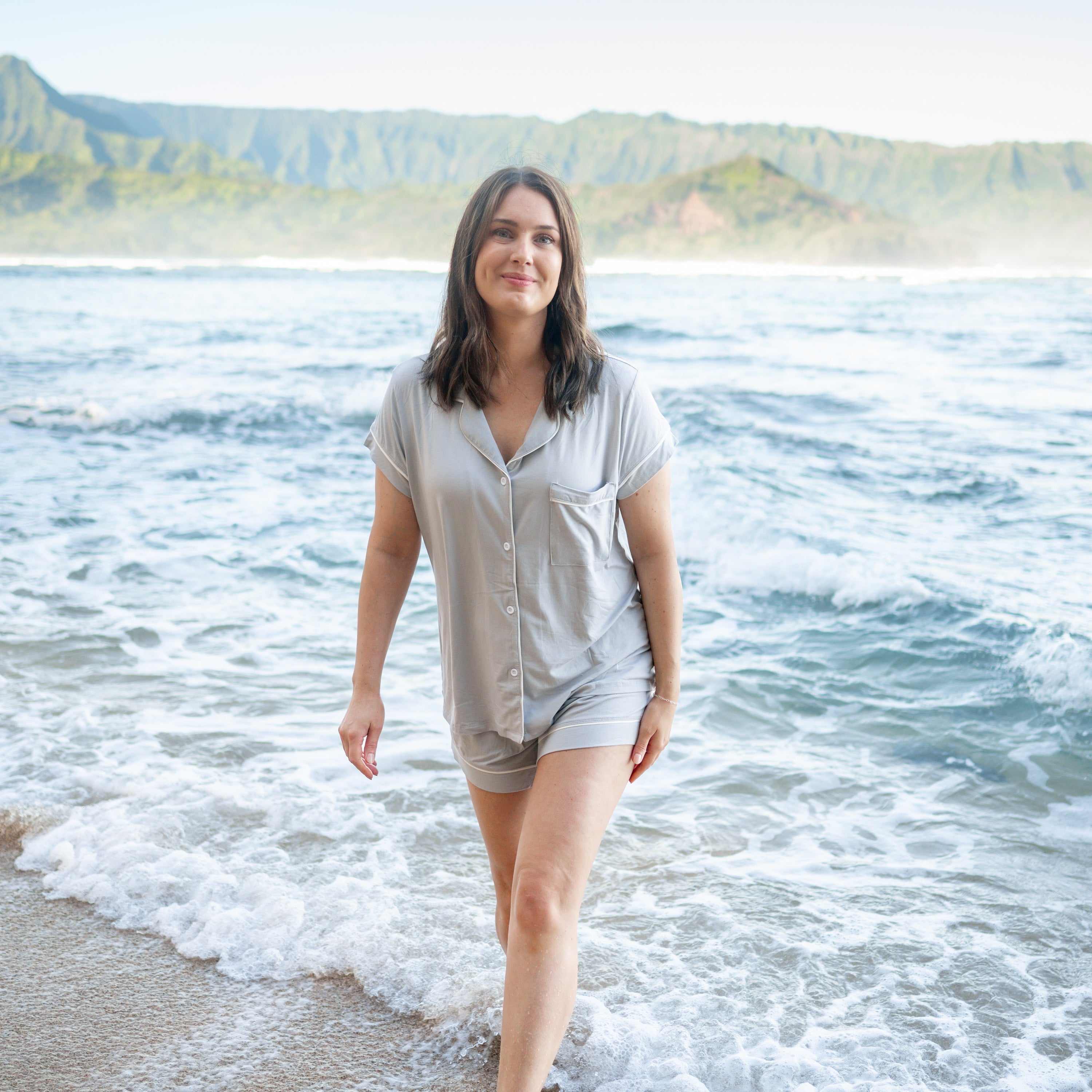 Woman modeling Women’s Short Sleeve Pajama Set in Storm with Cloud Trim on beach