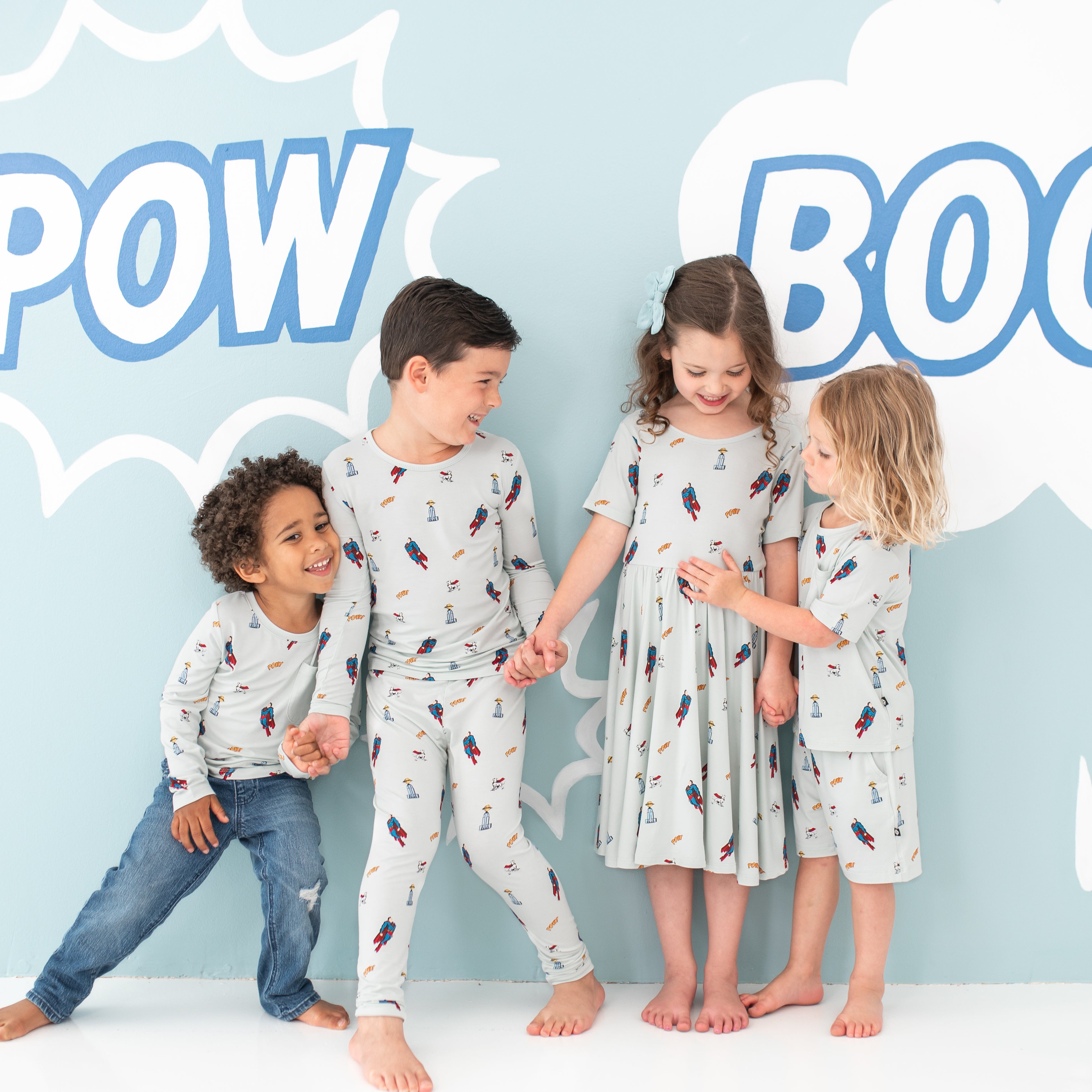 Group of 4 models wearing various items from the Superman™ collection