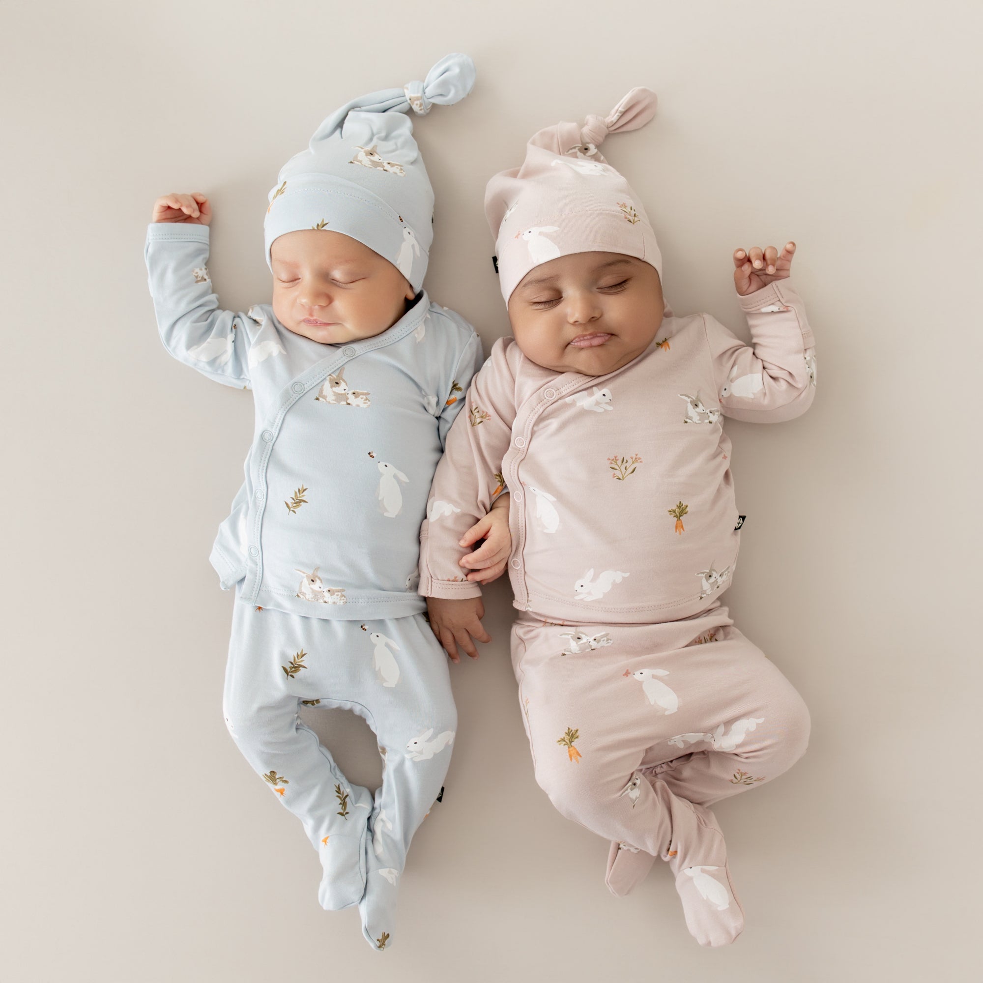 Babies wearing Take Me Home Set with Cap in Blush Rabbit and Ice Rabbit Spring prints