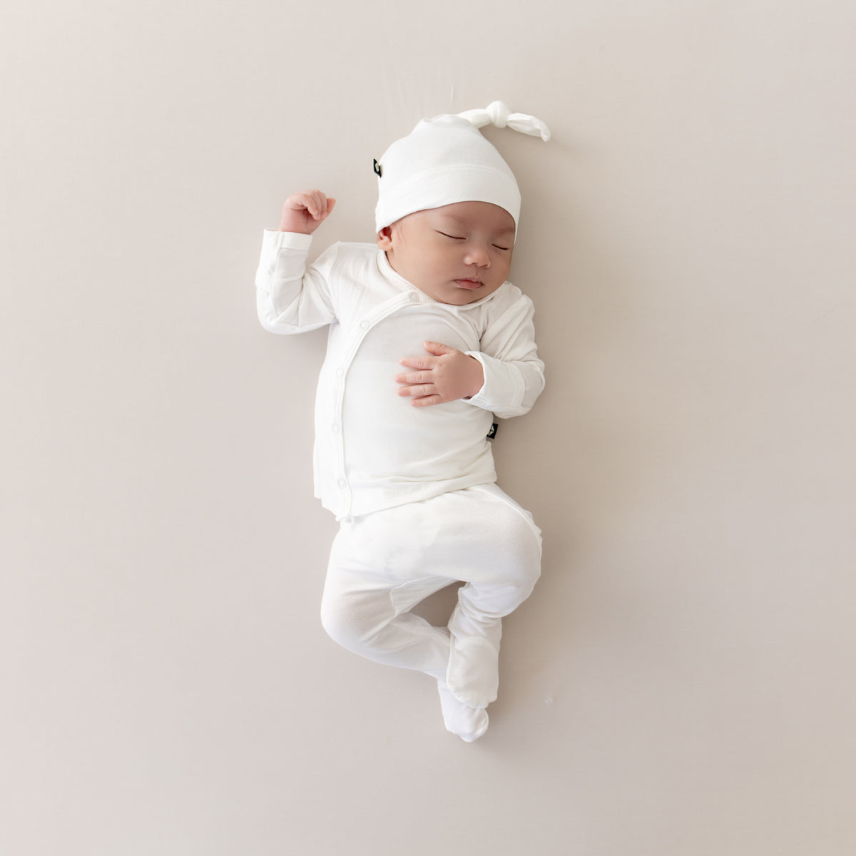 Baby wearing Take Me Home Set with Cap in Cloud White