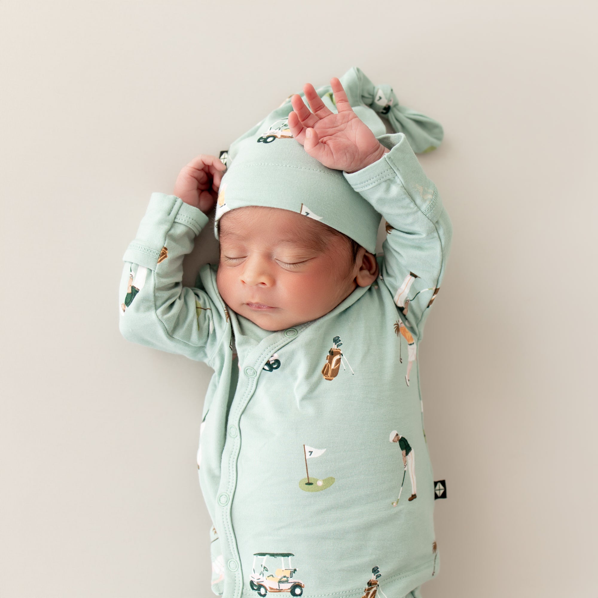 Newborn wearing Hospital Take Me Home Set with Cap in Golf