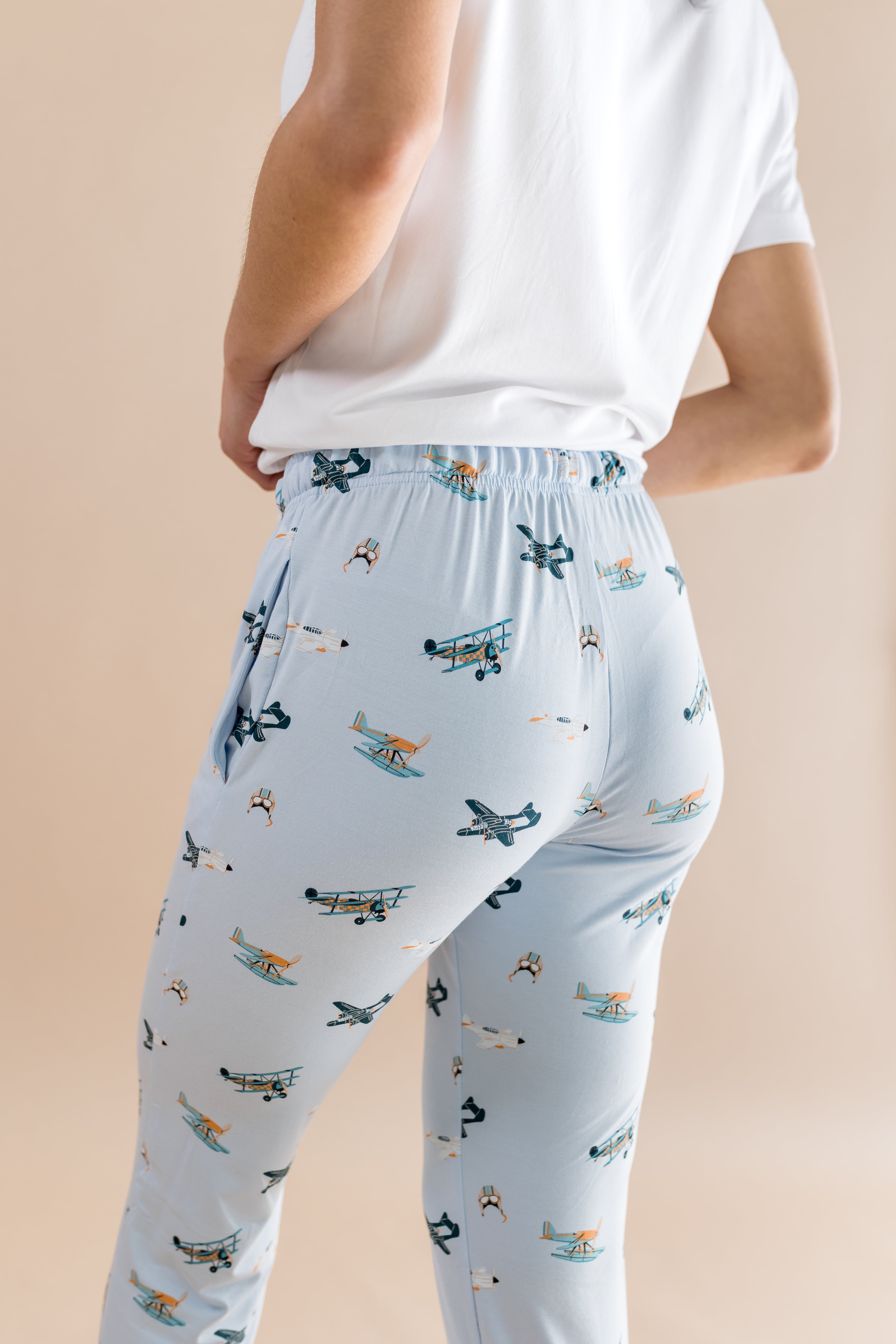 The back of the Women's Lounge Pants in Take Off shown on a female model