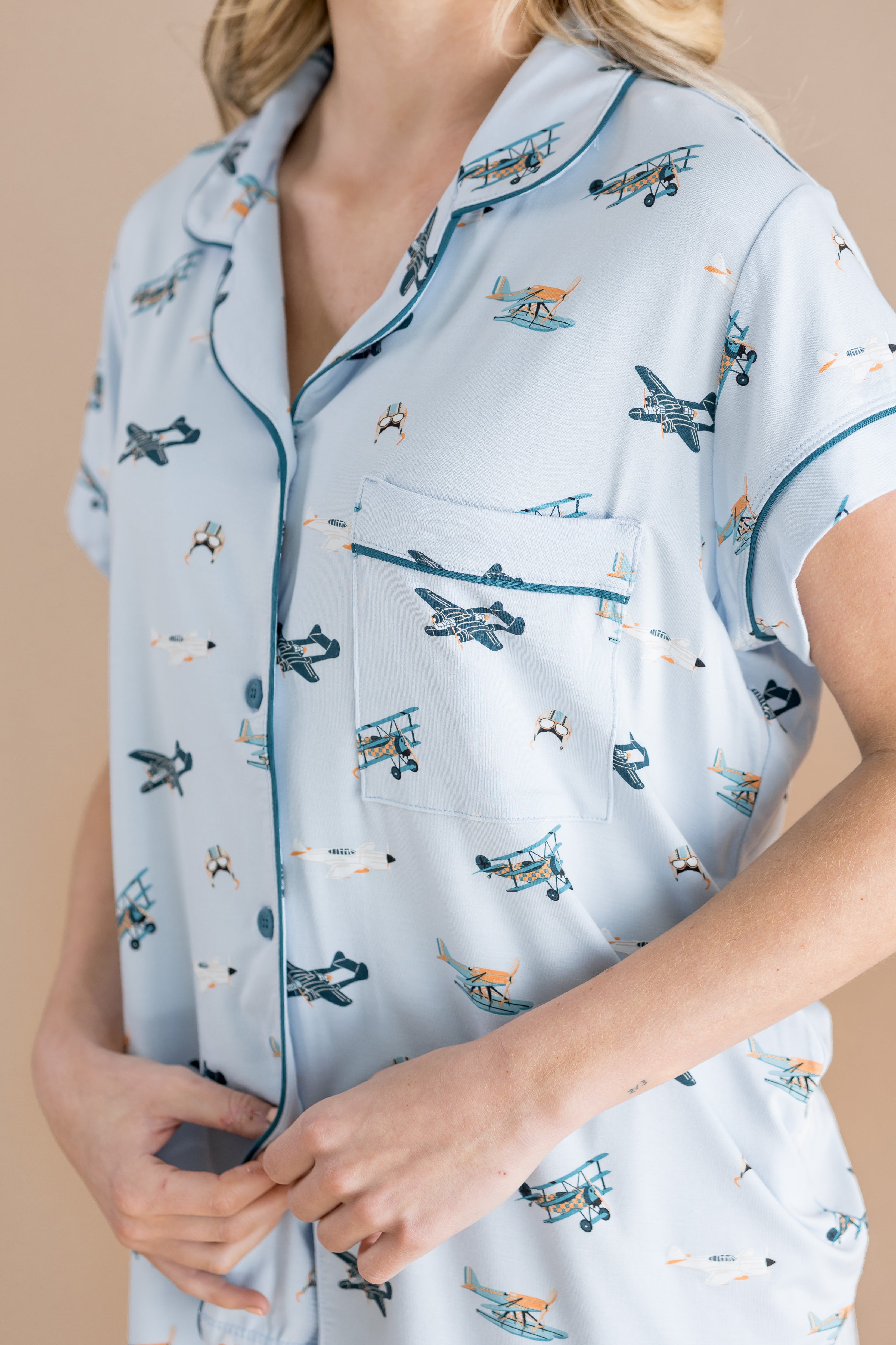 Close up of the dark blue trim and chest pocket on the shirt of the Women's Short Sleeve Pajama Set in Take Off
